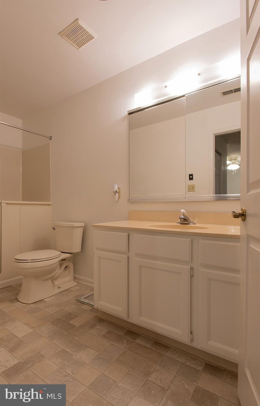 2000 Miller Avenue, Unit 26 Millville, NJ 08332 - Photo 23 of 25 a bathroom with a sink toilet and mirror