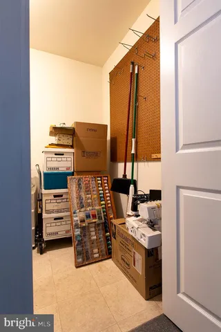 a kitchen with stainless steel appliances kitchen island granite countertop a stove and a refrigerator