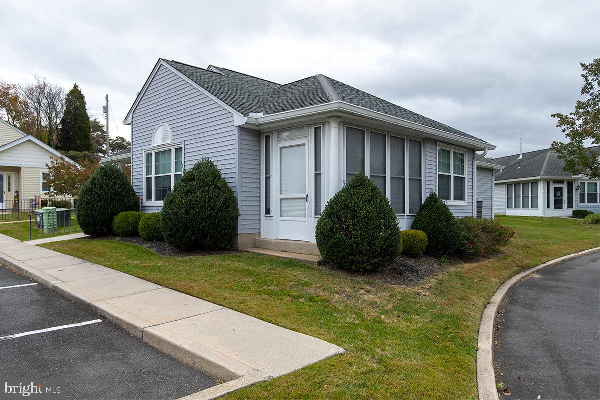 2000 Miller Avenue, Unit 26 Millville, NJ 08332 - Photo 3 of 25 a view of a house with a yard and plants