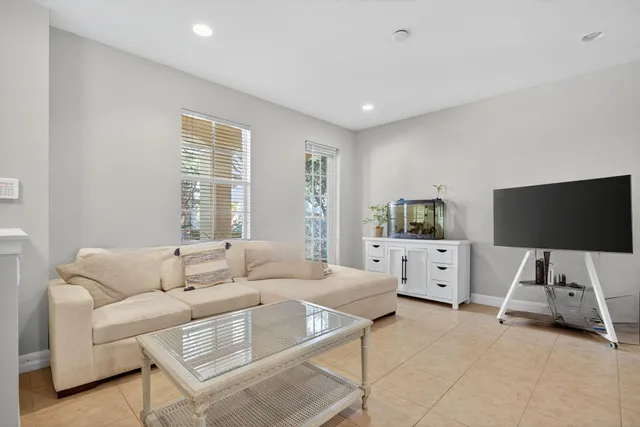 a kitchen with granite countertop white cabinets white stainless steel appliances with a sink and dishwasher