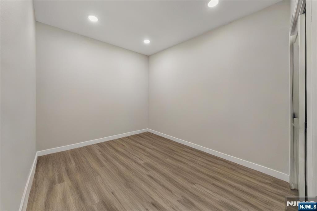 81 Wolcott Terrace Newark, NJ 07112 - Photo 13 of 20 a view of room with wooden floor