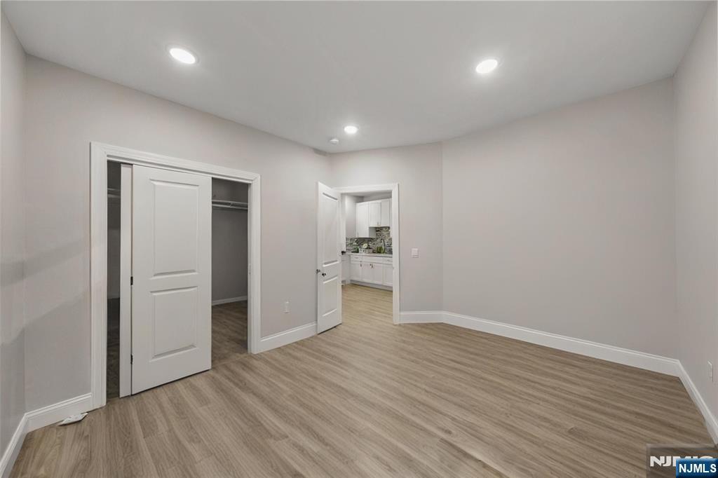 81 Wolcott Terrace Newark, NJ 07112 - Photo 15 of 20 a bathroom with a sink and a mirror