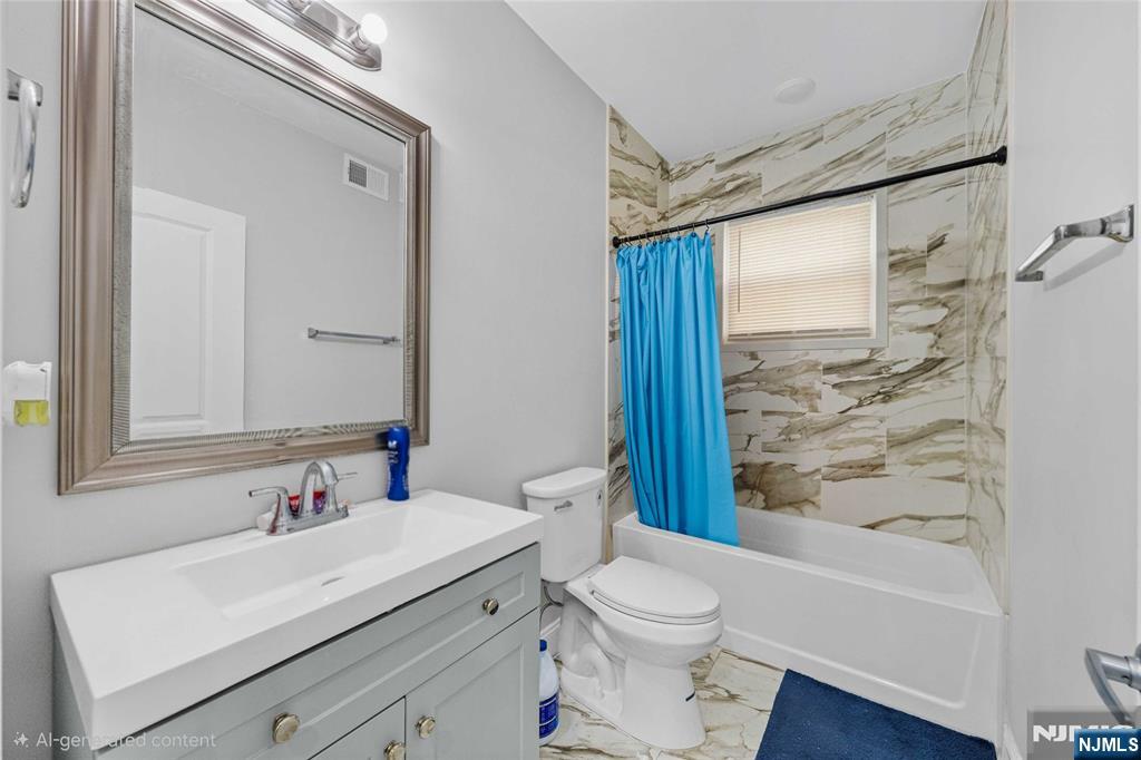 81 Wolcott Terrace Newark, NJ 07112 - Photo 16 of 20 a bathroom with a sink a toilet and shower