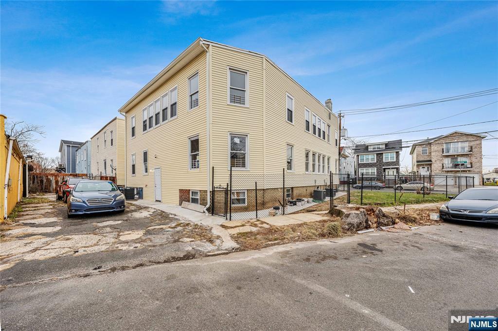 81 Wolcott Terrace Newark, NJ 07112 - Photo 19 of 20 a view of a house with truck parked