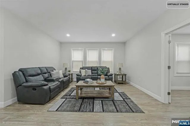 a living room with furniture and a rug