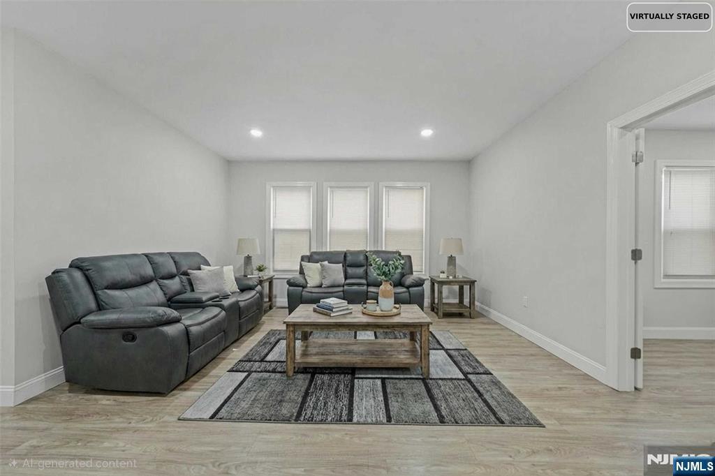 81 Wolcott Terrace Newark, NJ 07112 - Photo 2 of 20 a living room with furniture and a rug