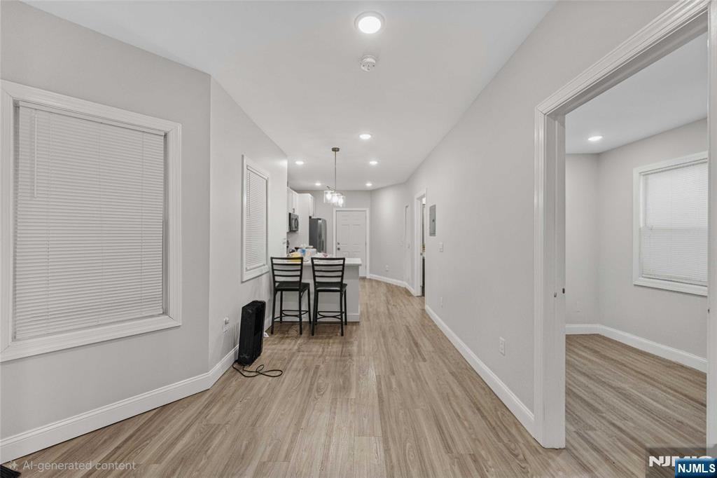 81 Wolcott Terrace Newark, NJ 07112 - Photo 4 of 20 a view of kitchen with furniture and wooden floor
