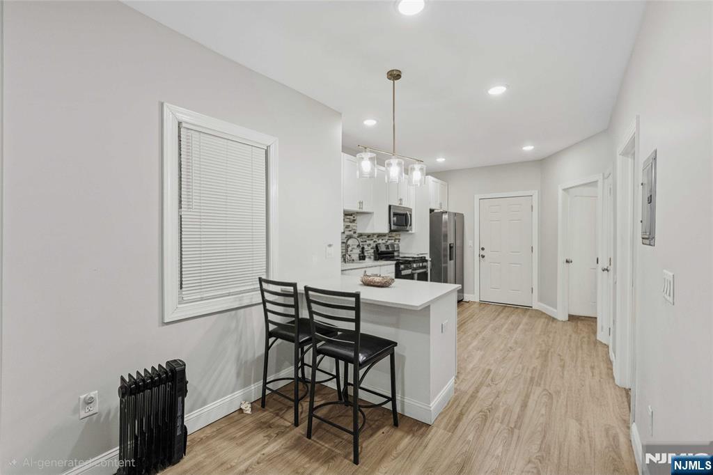 81 Wolcott Terrace Newark, NJ 07112 - Photo 6 of 20 a view of a kitchen and dining room