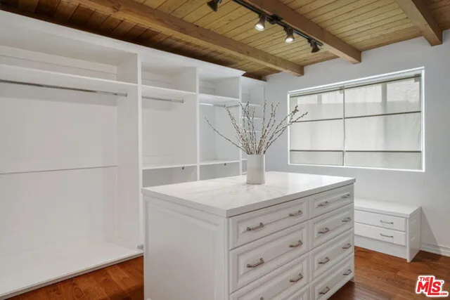 a view of cabinets and wooden floor