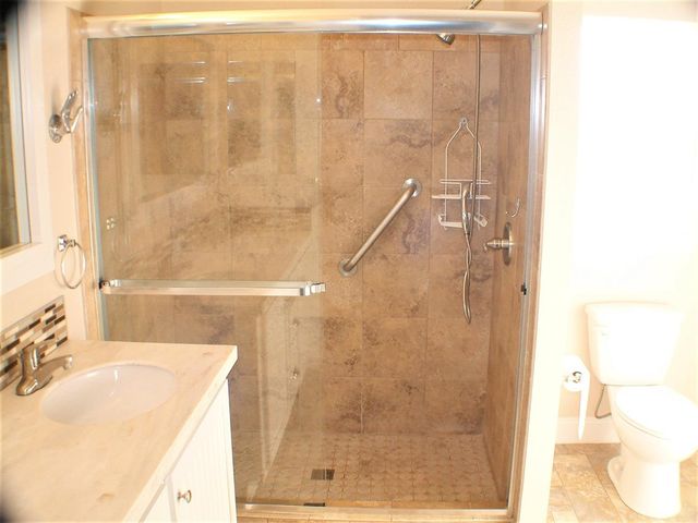 a view of a sink and a mirror