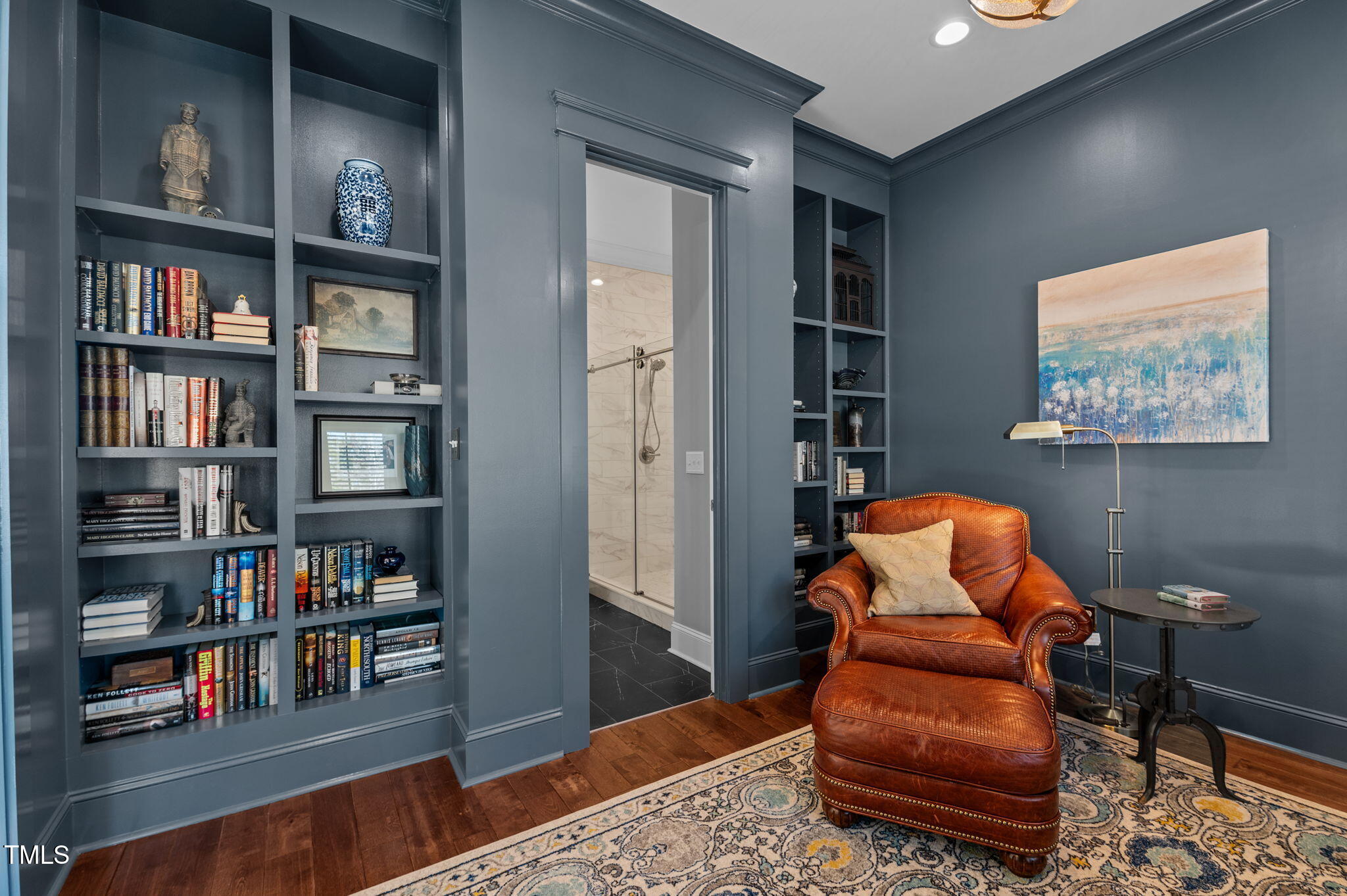 992 Estate Road Semora, NC 27343 - Photo 13 of 77 a living room with furniture and a book shelf