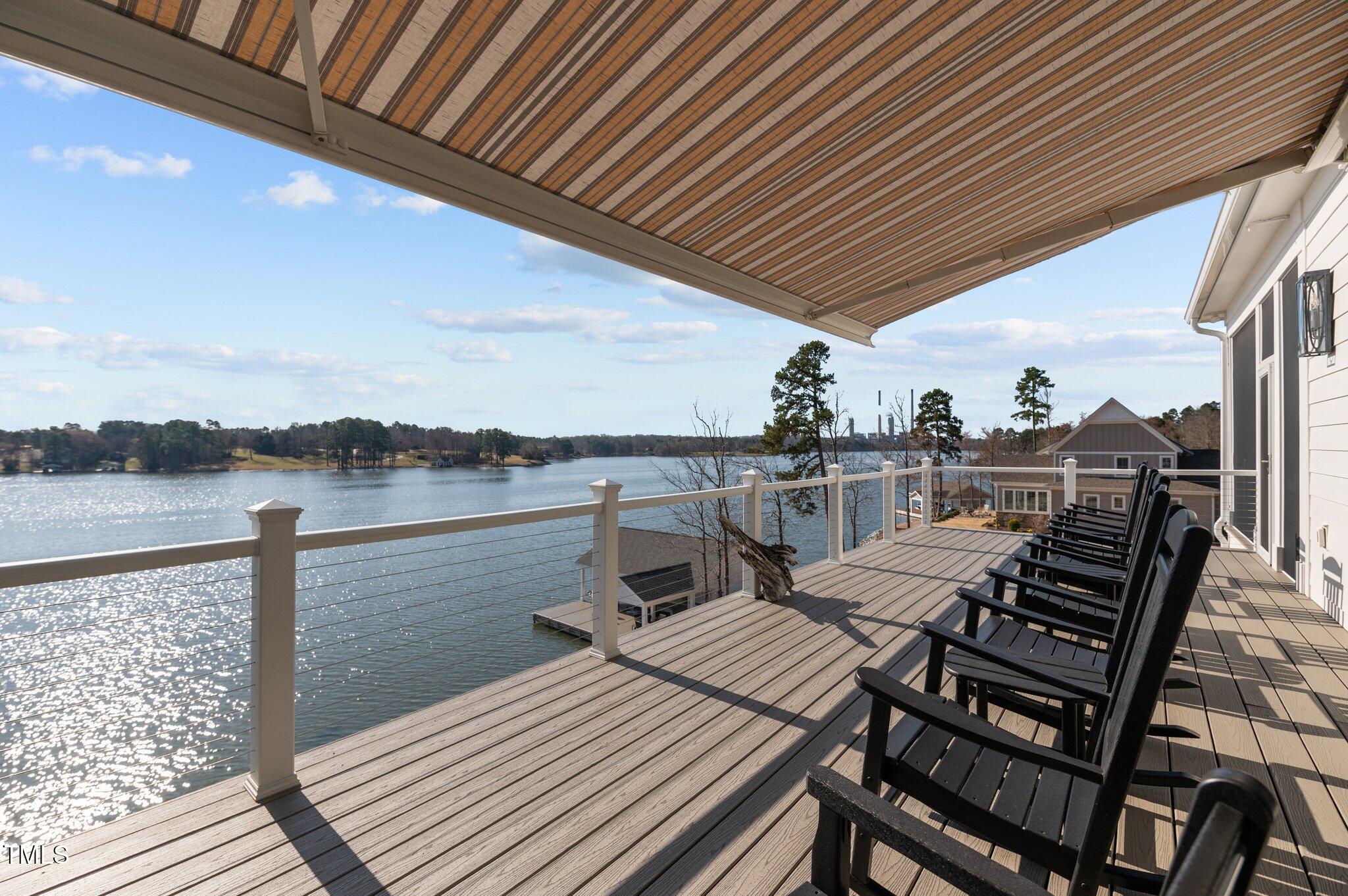 992 Estate Road Semora, NC 27343 - Photo 28 of 77 a view of a balcony with wooden floor and outdoor seating