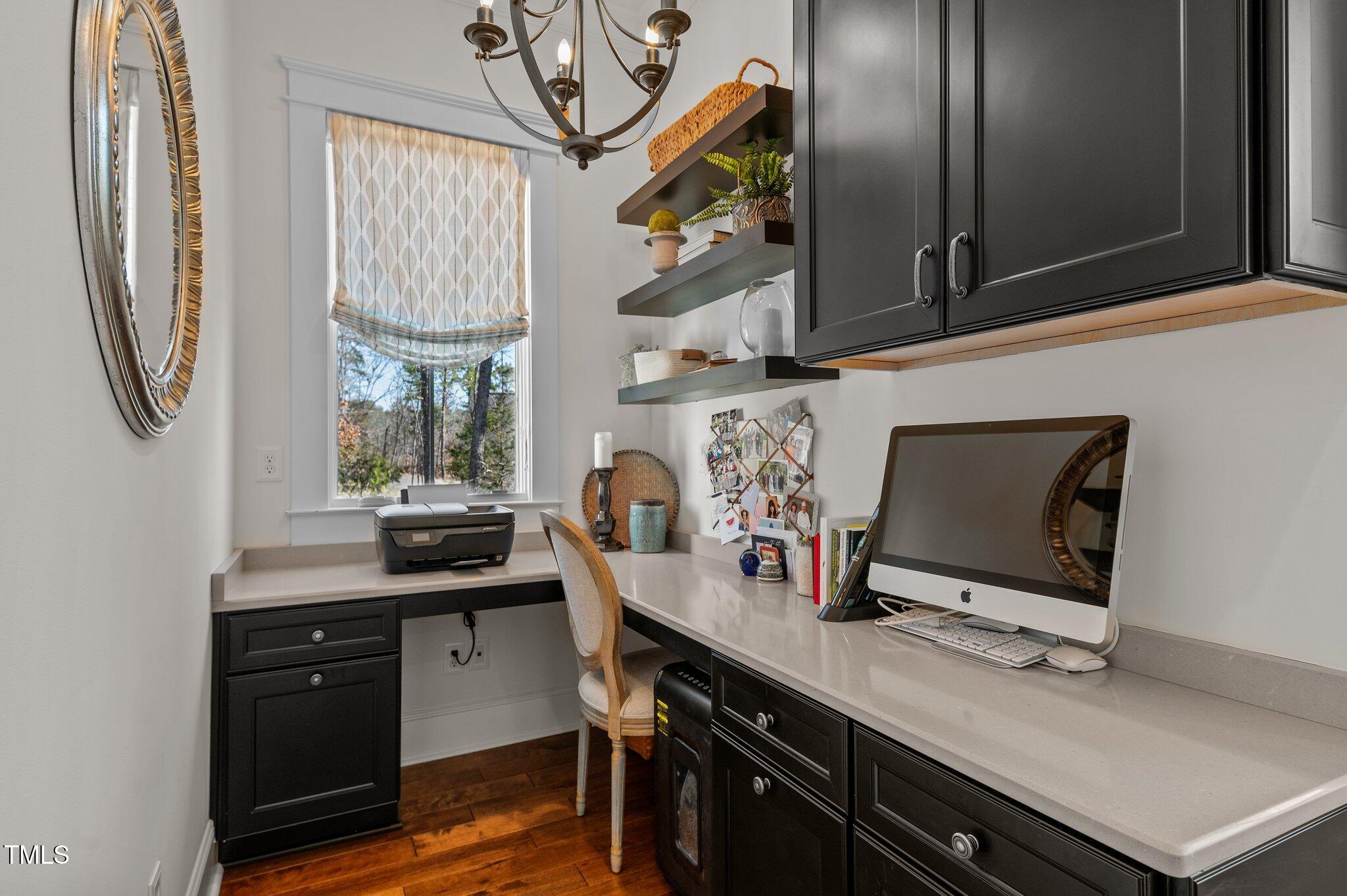 992 Estate Road Semora, NC 27343 - Photo 36 of 77 a view of a workspace with furniture and a flat screen tv