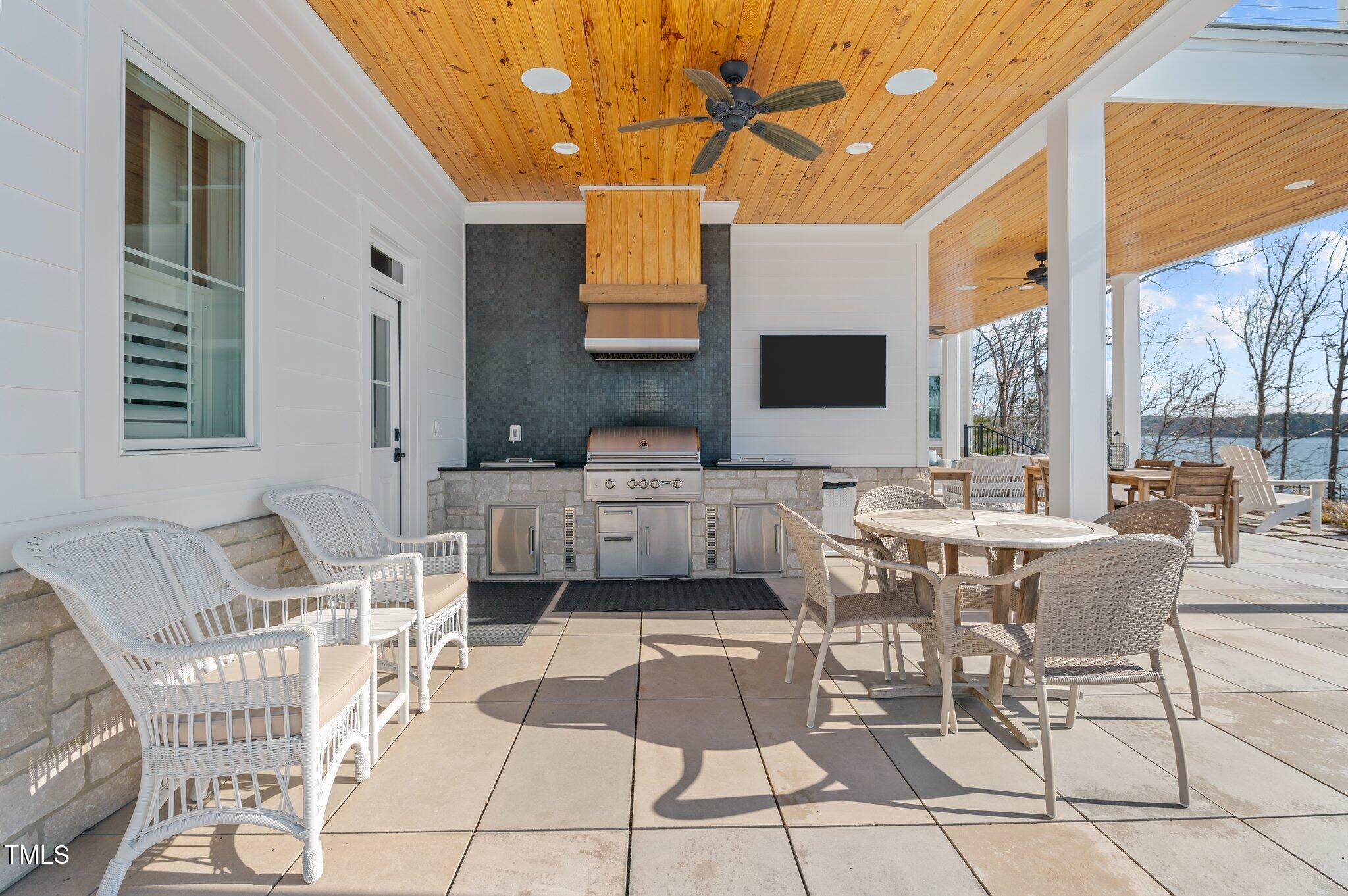 992 Estate Road Semora, NC 27343 - Photo 52 of 77 a living room with furniture and a flat screen tv