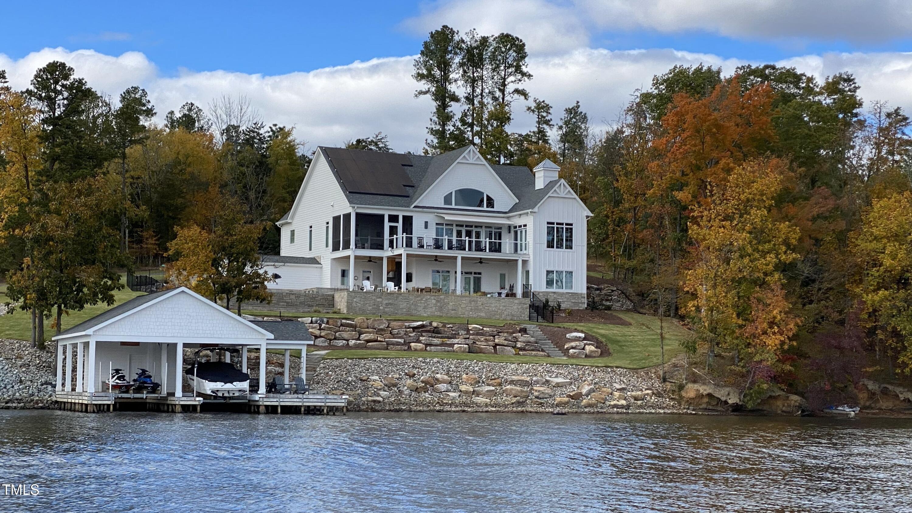 992 Estate Road Semora, NC 27343 - Photo 67 of 77 a front view of a house with a yard and large trees