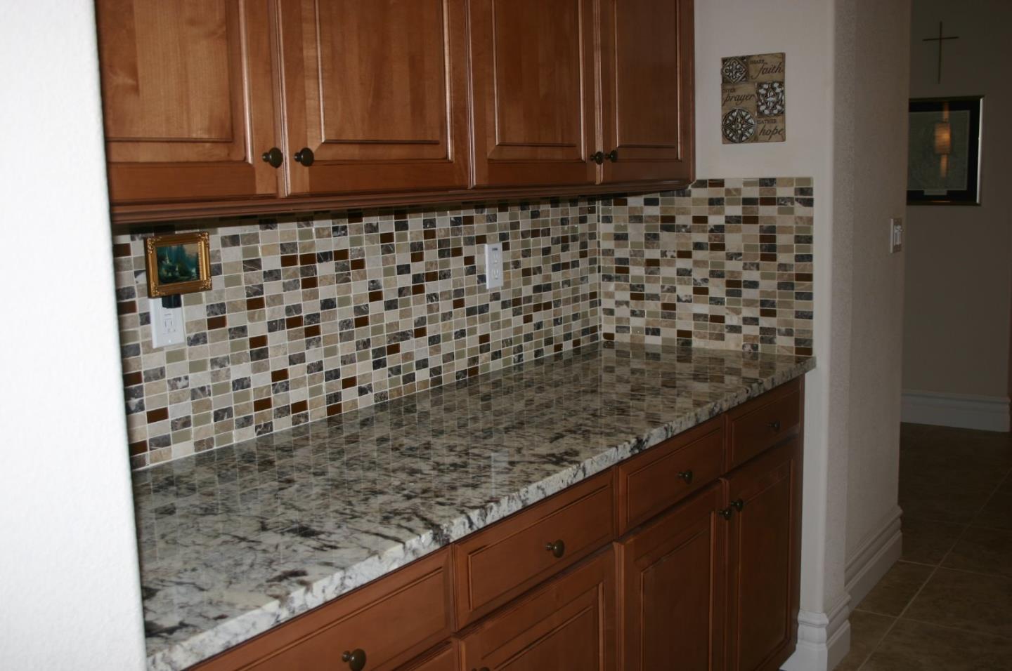 7247 Pitlochry Drive Gilroy, CA 95020 - Photo 11 of 44 a bathroom with a granite countertop sink and a mirror