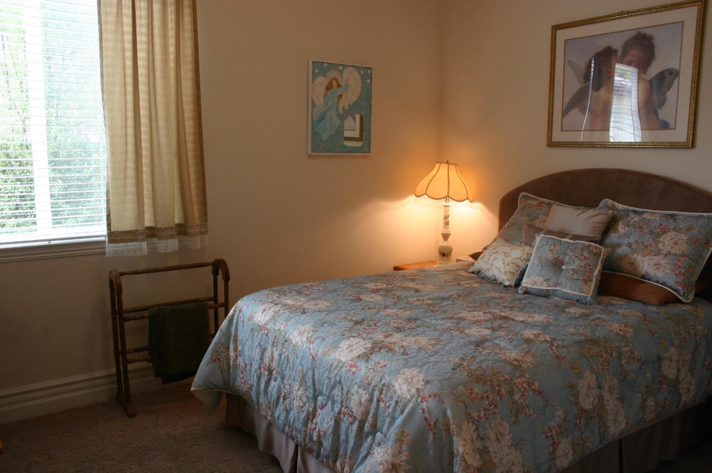 7247 Pitlochry Drive Gilroy, CA 95020 - Photo 15 of 44 a bed sitting in a bedroom next to a window