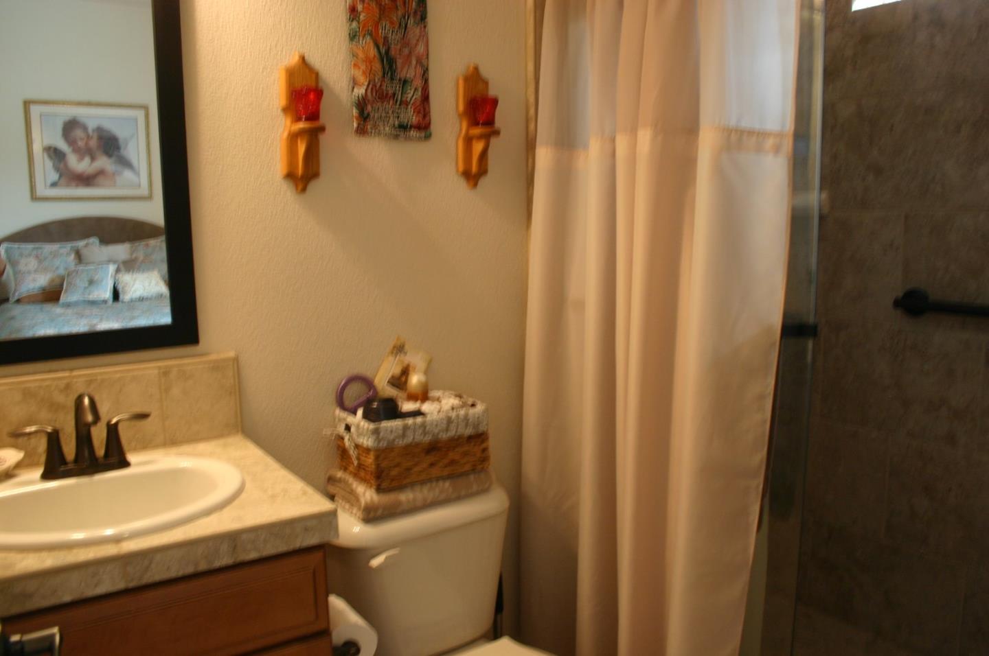 7247 Pitlochry Drive Gilroy, CA 95020 - Photo 16 of 44 a bathroom with a sink toilet and vanity