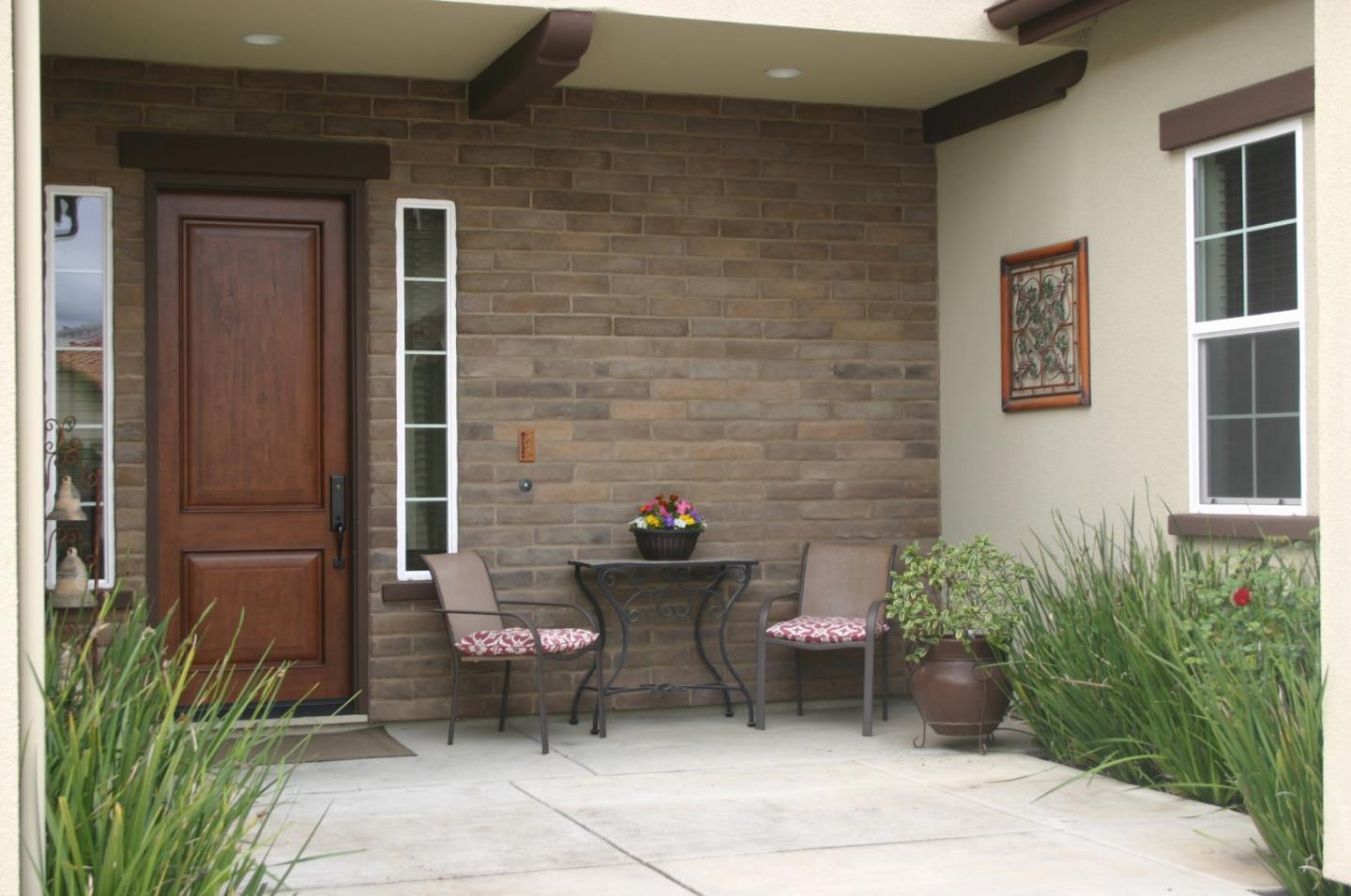 7247 Pitlochry Drive Gilroy, CA 95020 - Photo 3 of 44 a view of a patio with table and chairs and potted plants