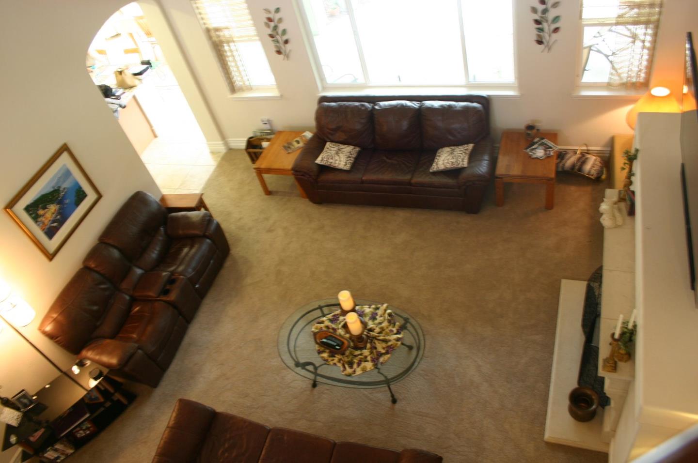 7247 Pitlochry Drive Gilroy, CA 95020 - Photo 5 of 44 a living room with furniture and a mirror