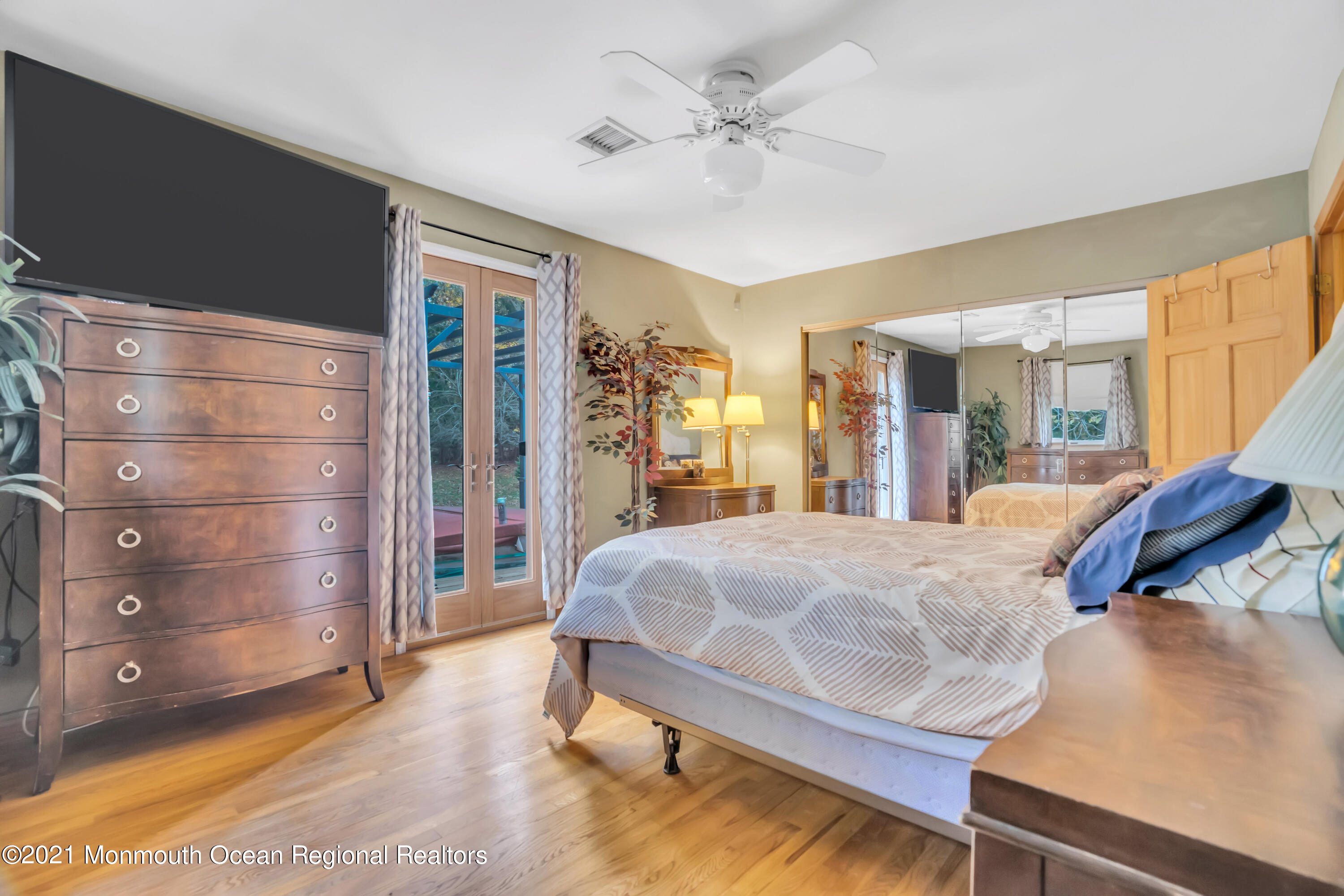 615 West Farms Road Howell, NJ 07731 - Photo 12 of 36 a bed room with a bed and mirror