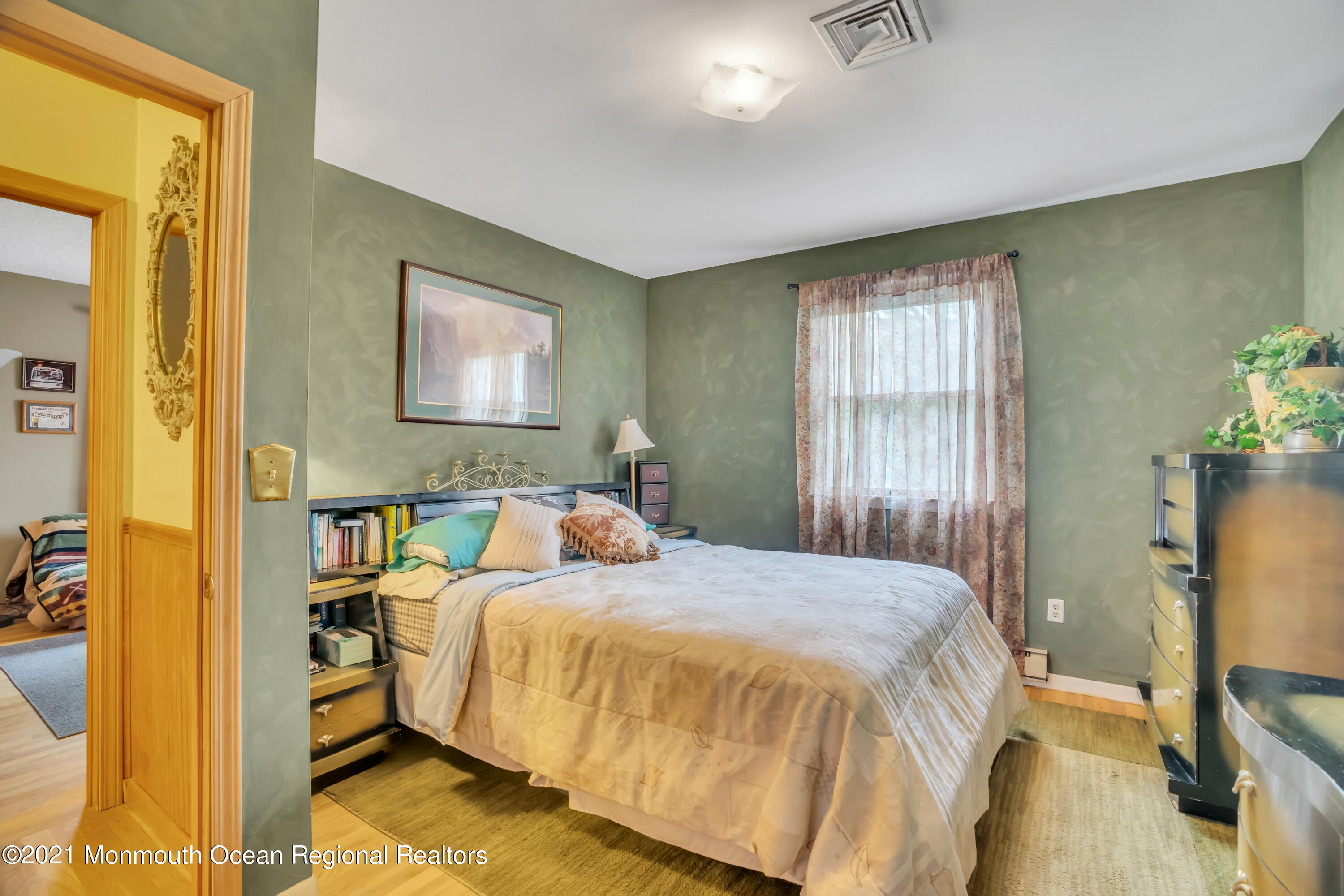 615 West Farms Road Howell, NJ 07731 - Photo 14 of 36 a bedroom with a bed and a flat screen tv