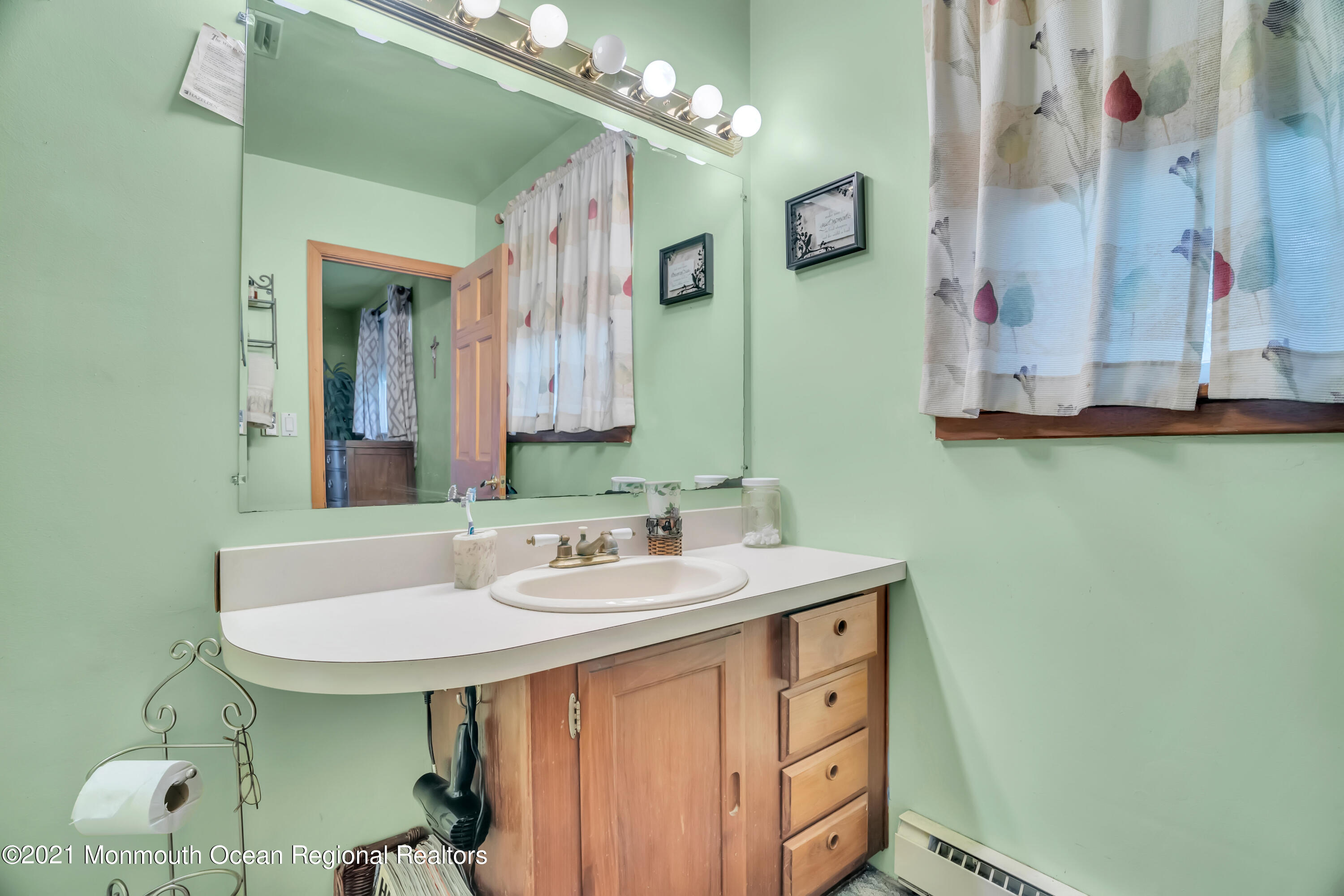 615 West Farms Road Howell, NJ 07731 - Photo 17 of 36 a bathroom with a sink and a mirror