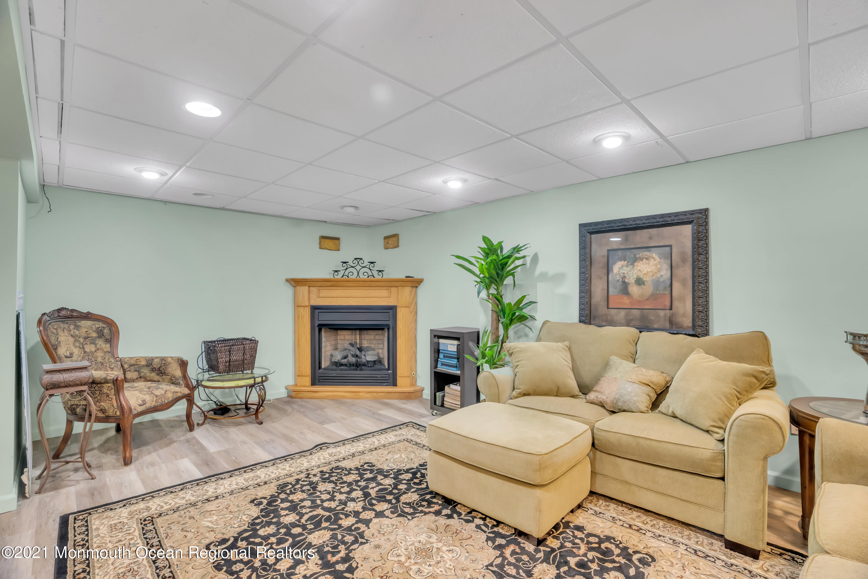 615 West Farms Road Howell, NJ 07731 - Photo 21 of 36 a living room with furniture and a fireplace
