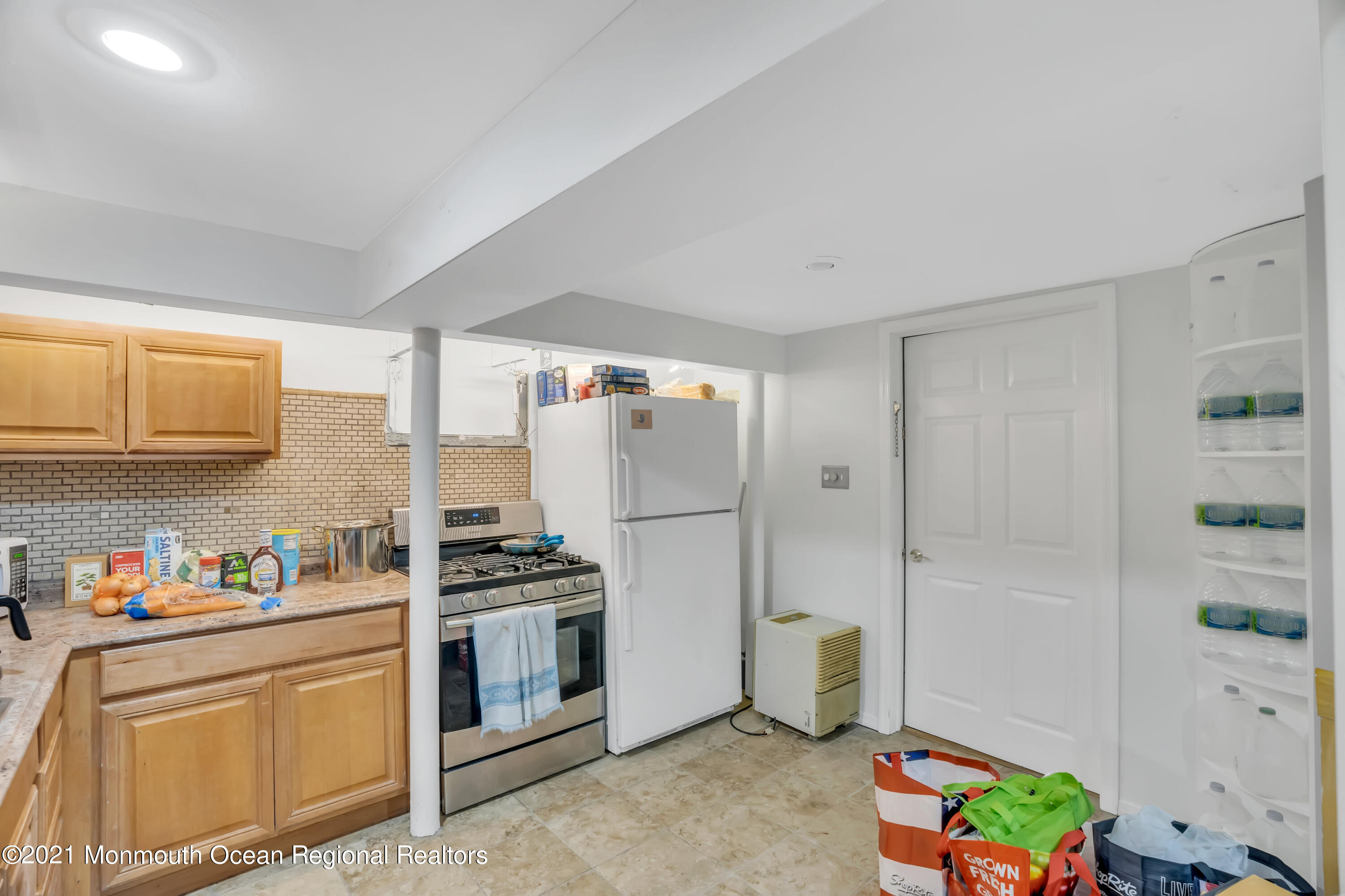 615 West Farms Road Howell, NJ 07731 - Photo 25 of 36 a kitchen with stainless steel appliances a refrigerator and a stove top oven