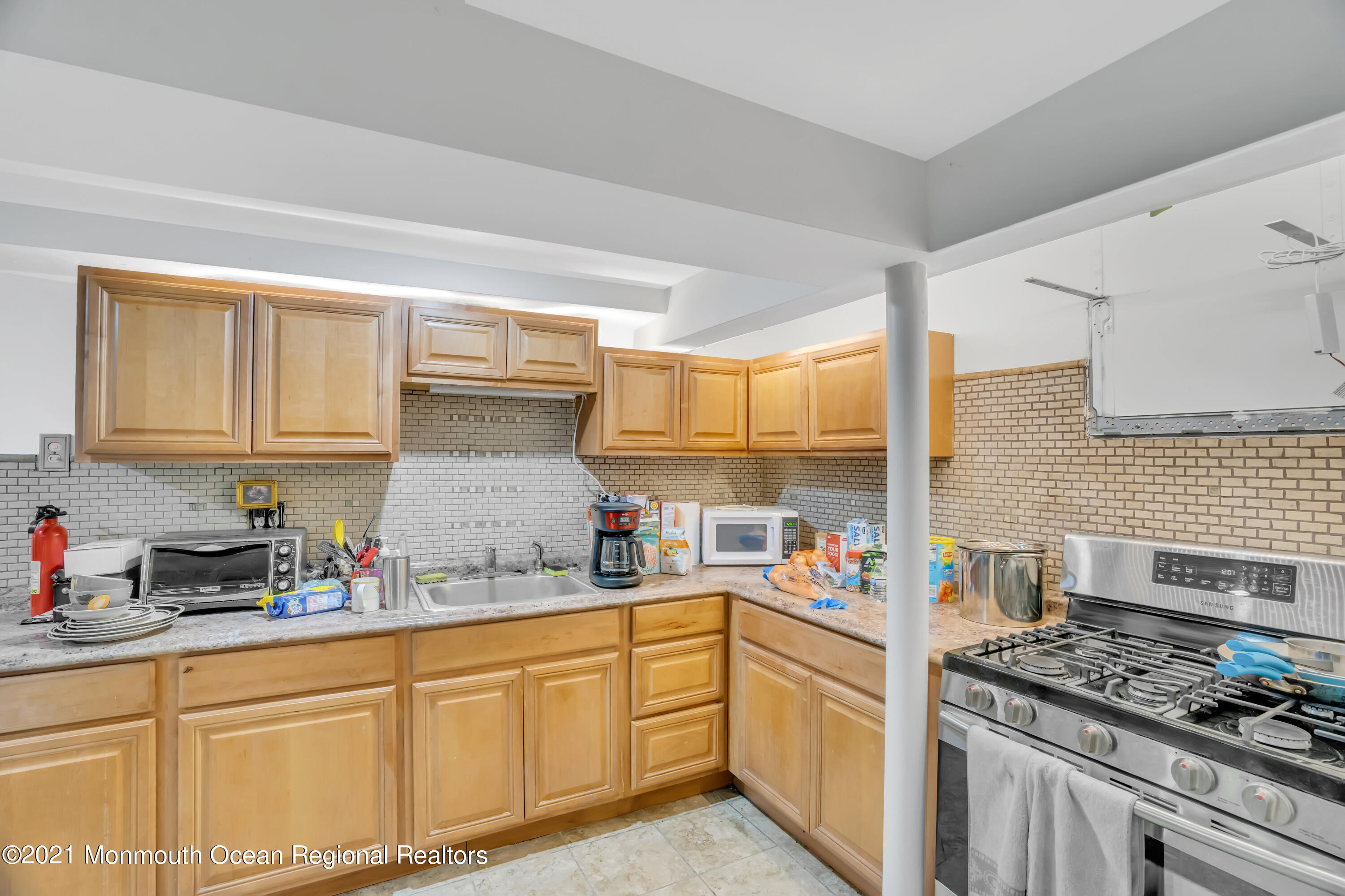 615 West Farms Road Howell, NJ 07731 - Photo 27 of 36 a kitchen with granite countertop cabinets stainless steel appliances and sink
