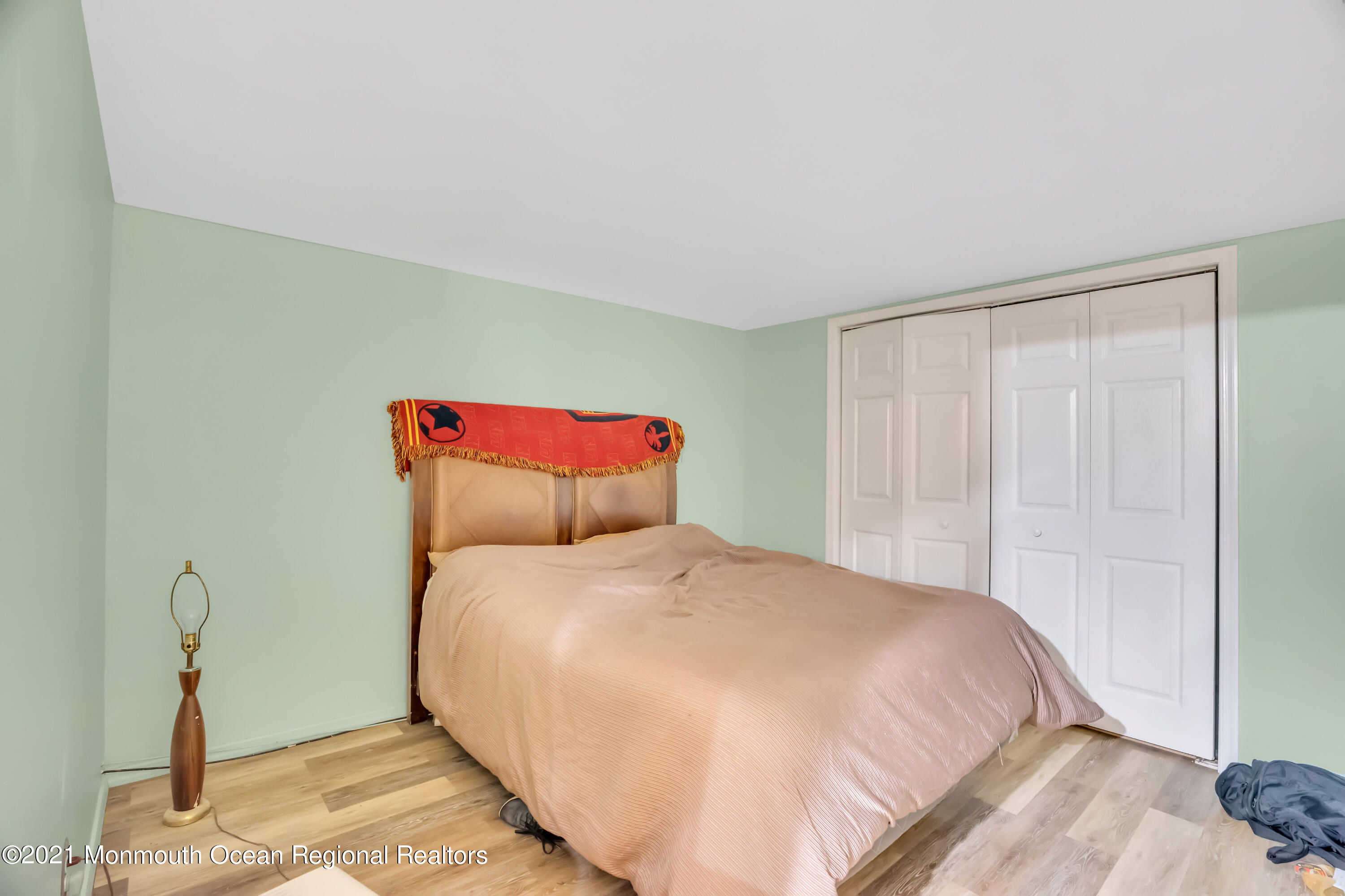 615 West Farms Road Howell, NJ 07731 - Photo 29 of 36 a large bed sitting in a bedroom next to a window
