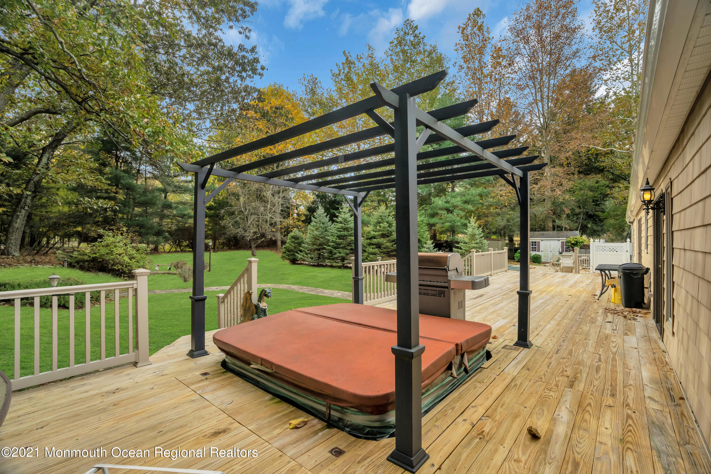 615 West Farms Road Howell, NJ 07731 - Photo 33 of 36 a view of a deck with a table chairs and a backyard