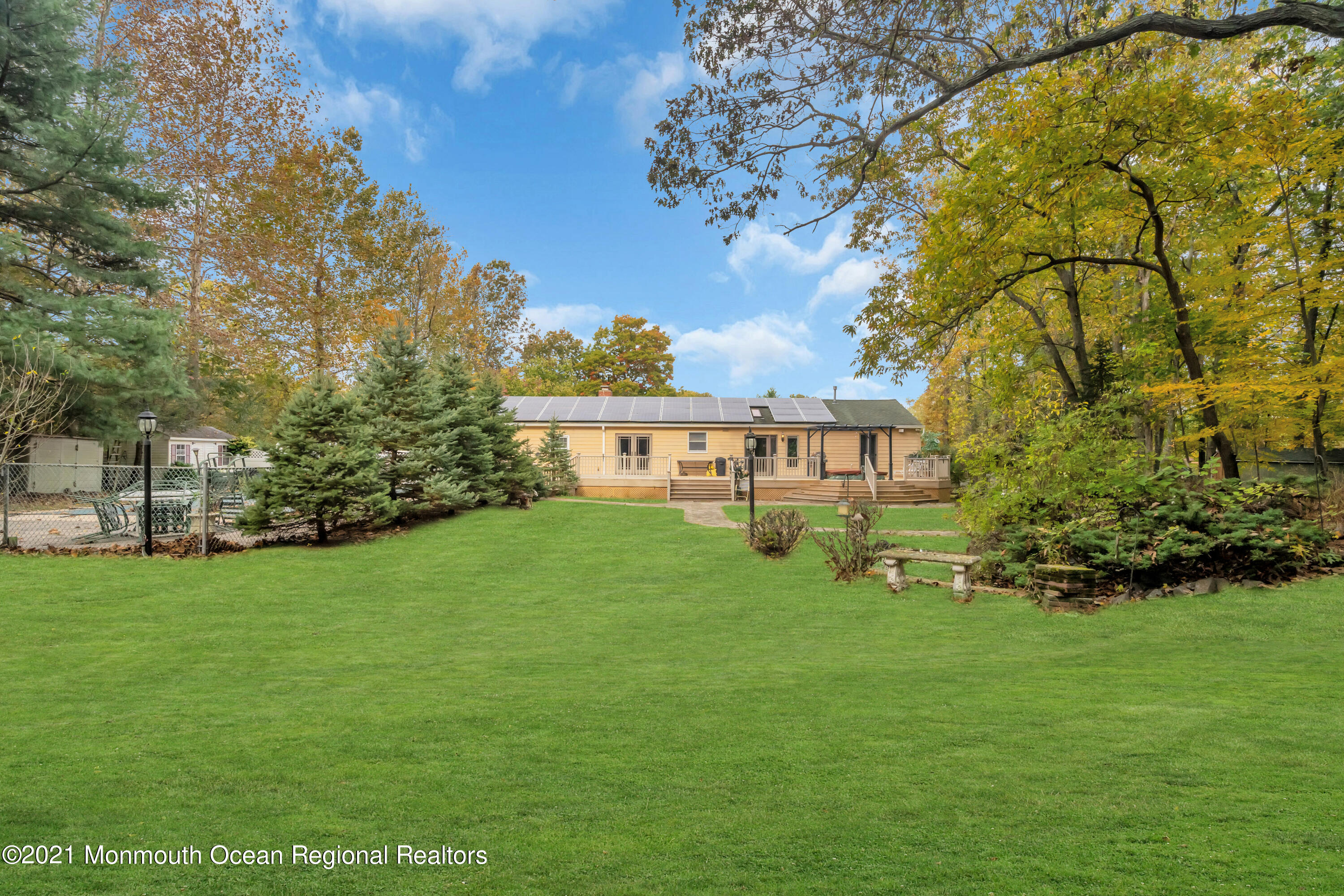 615 West Farms Road Howell, NJ 07731 - Photo 35 of 36 a view of a house with a big yard potted plants and large tree