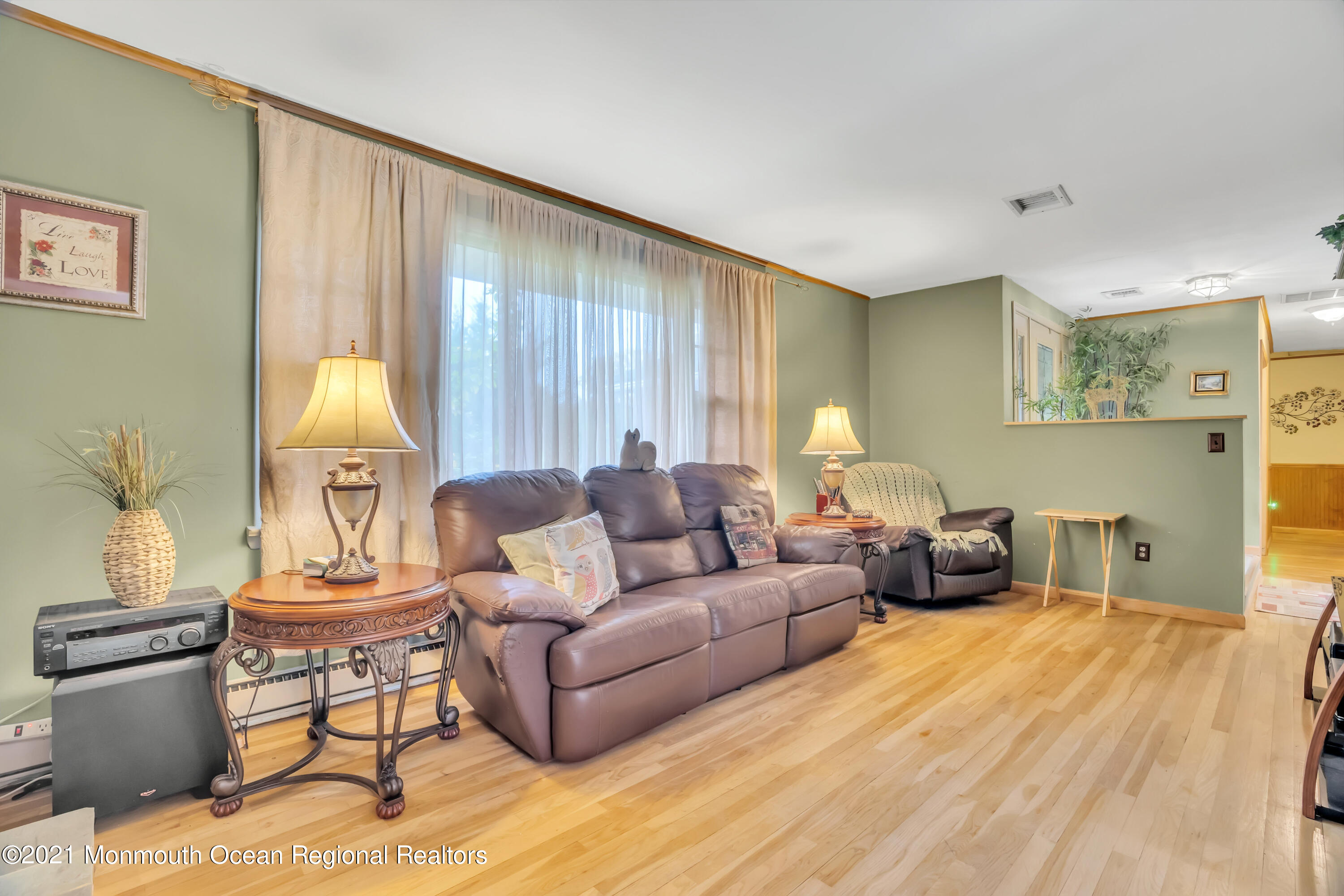 615 West Farms Road Howell, NJ 07731 - Photo 5 of 36 a living room with furniture and a lamp
