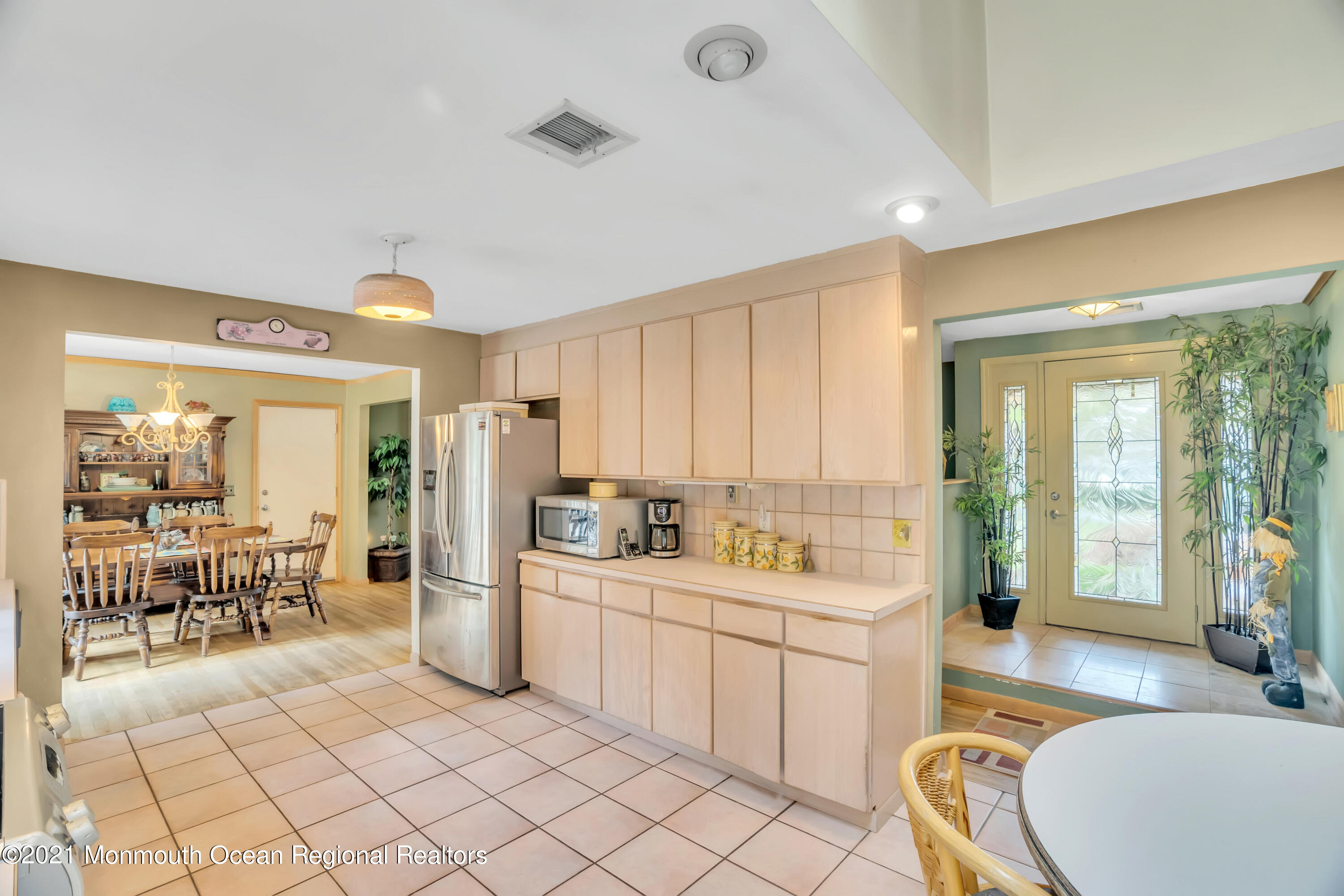 615 West Farms Road Howell, NJ 07731 - Photo 8 of 36 a large white kitchen with a large window and stainless steel appliances