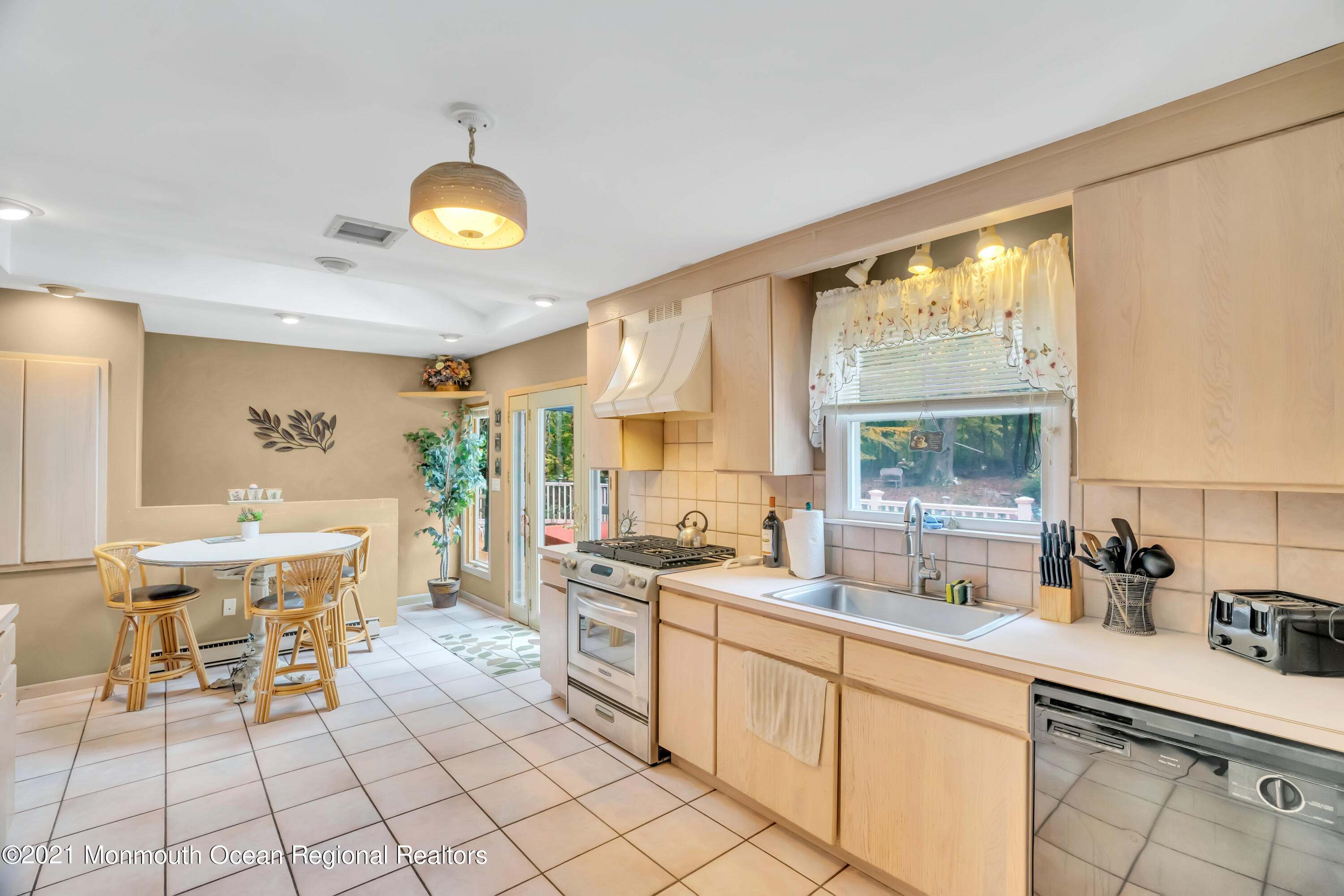 615 West Farms Road Howell, NJ 07731 - Photo 9 of 36 a kitchen with a sink and chairs