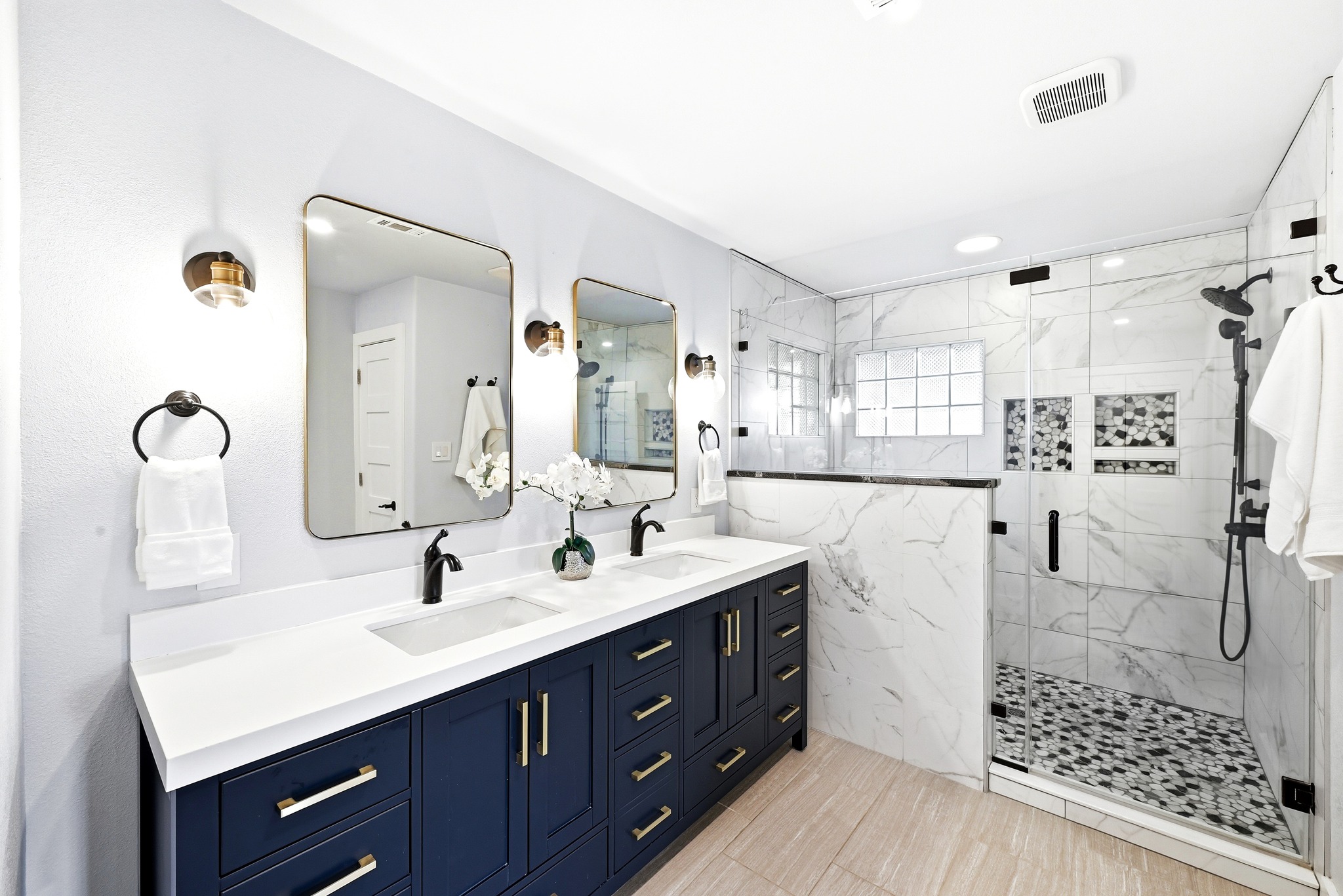 2405 Bahama Road Austin, TX 78733 - Photo 24 of 39 a bathroom with a double vanity sink a toilet a mirror and shower
