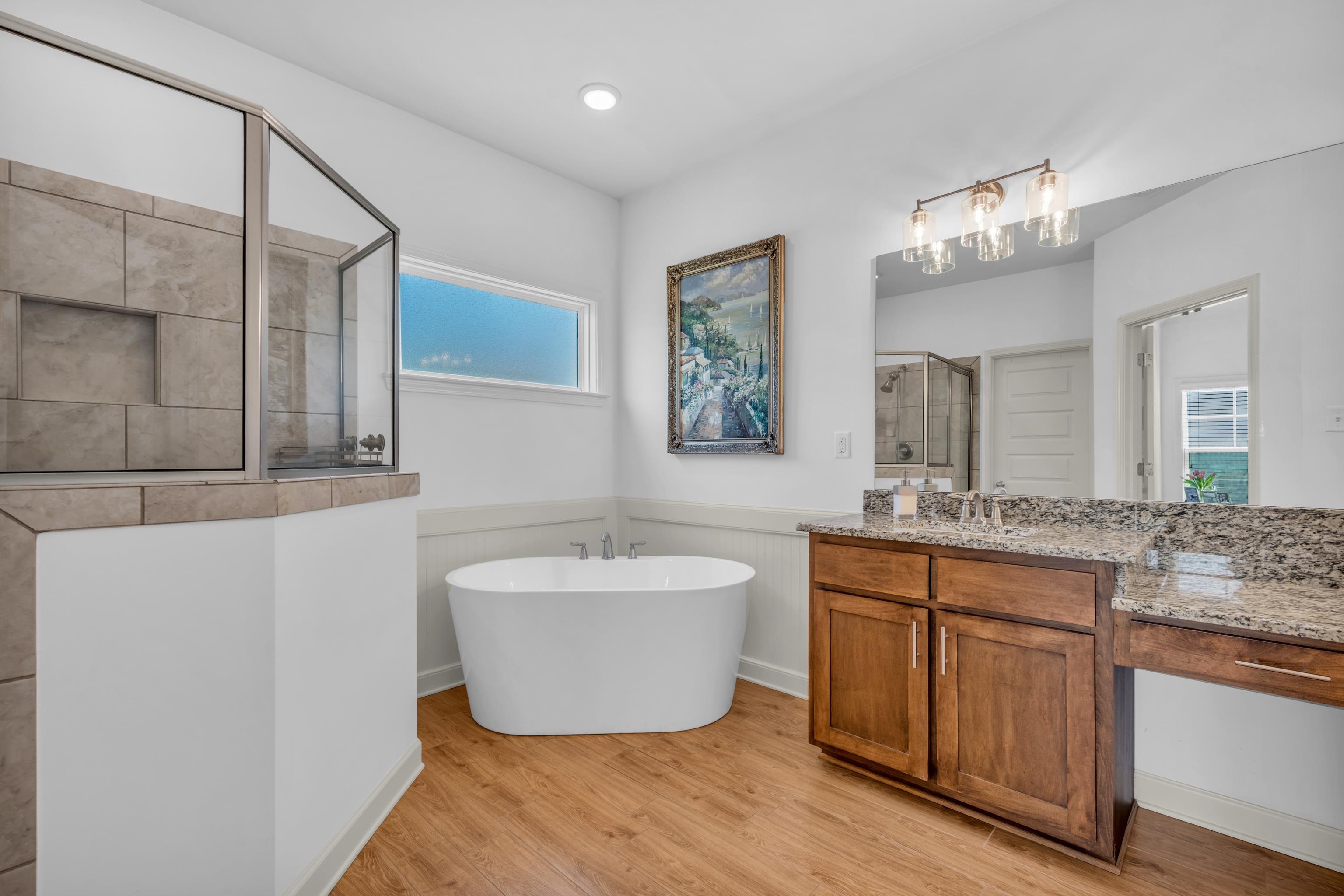 20 Thorpe Cove Piperton, TN 38017 - Photo 23 of 39 a spacious bathroom with a double vanity sink mirror and a bathtub