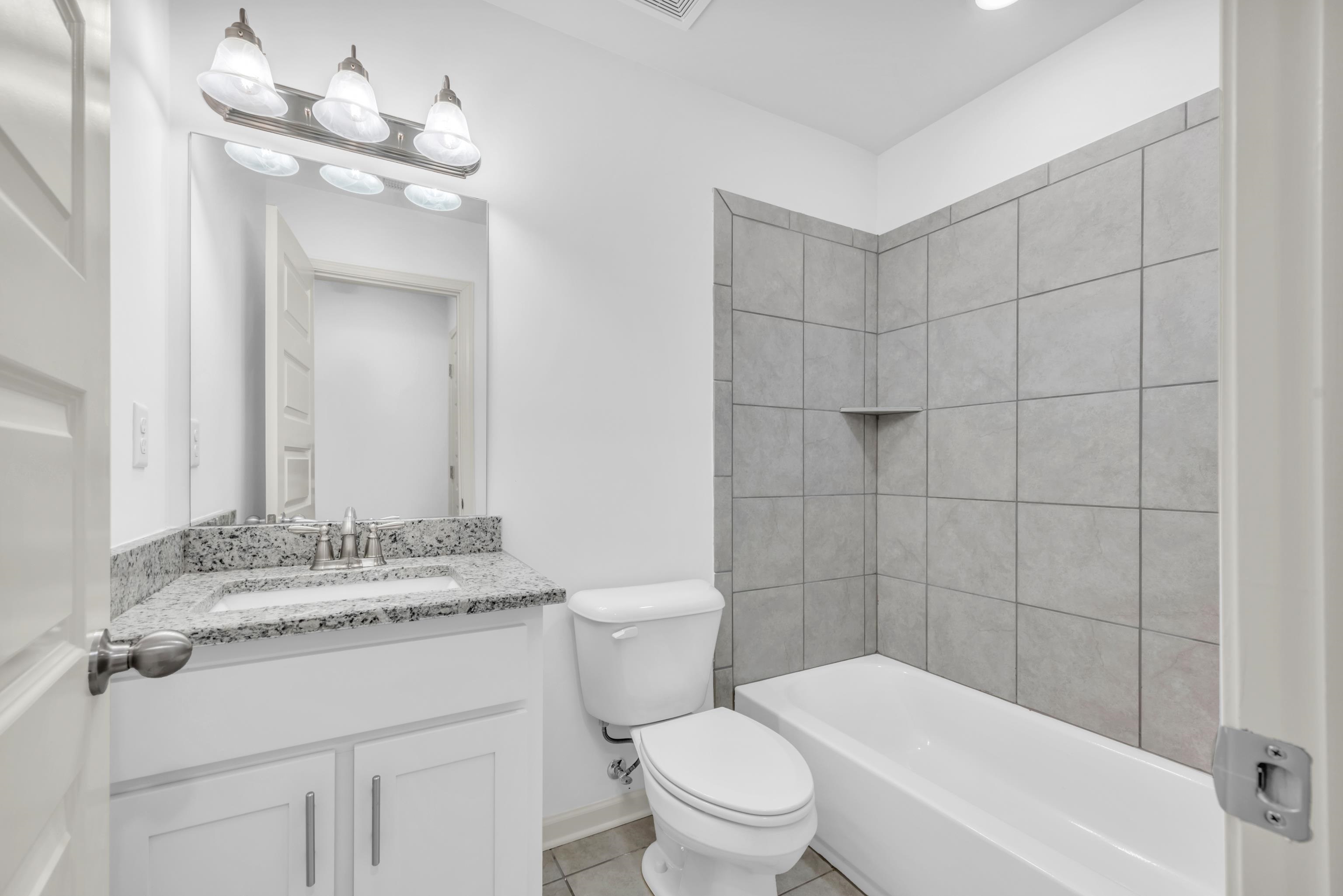 20 Thorpe Cove Piperton, TN 38017 - Photo 32 of 39 a bathroom with a sink a toilet a mirror and shower