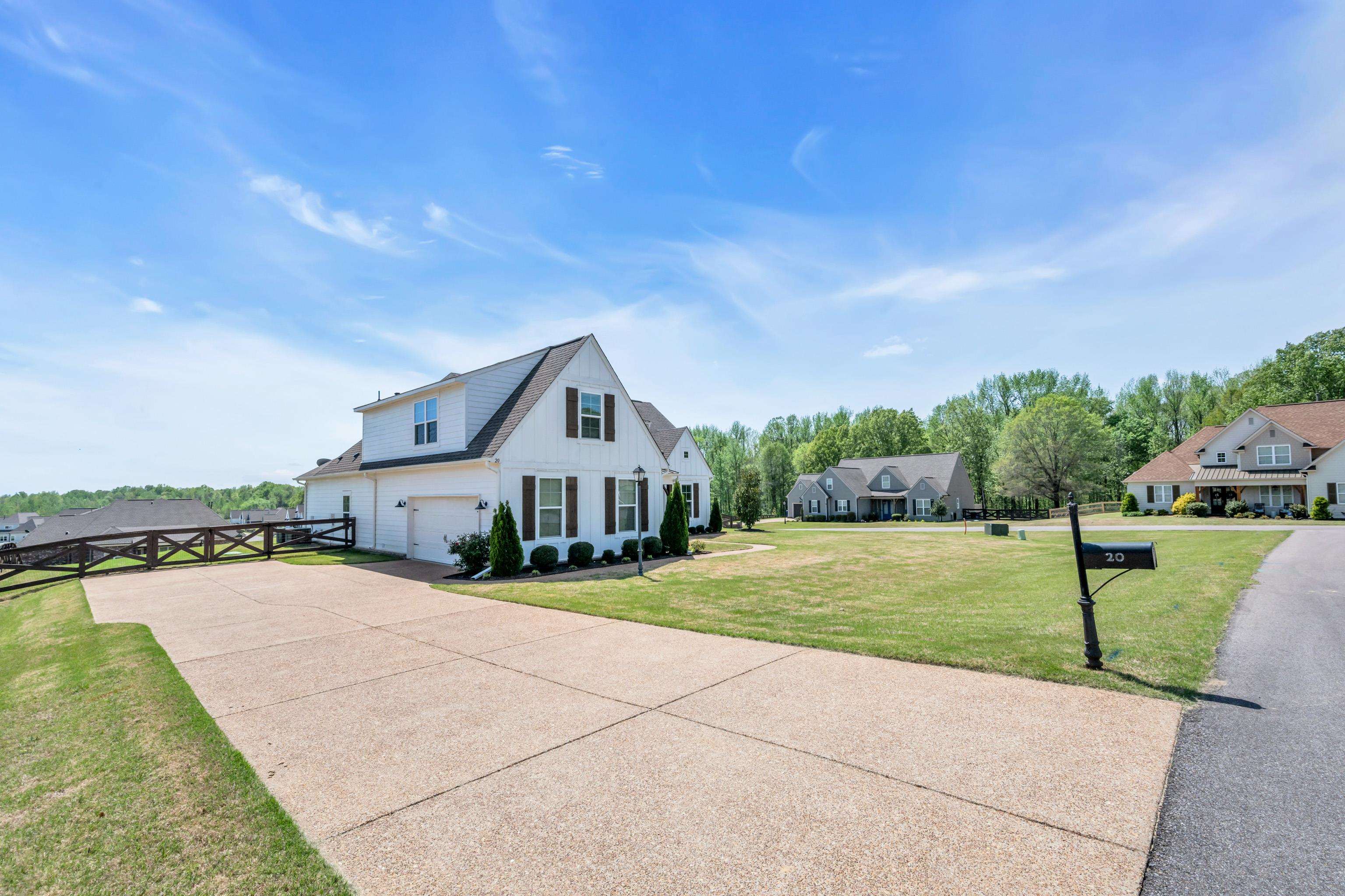 20 Thorpe Cove Piperton, TN 38017 - Photo 4 of 39 a view of a house with a yard and lake view