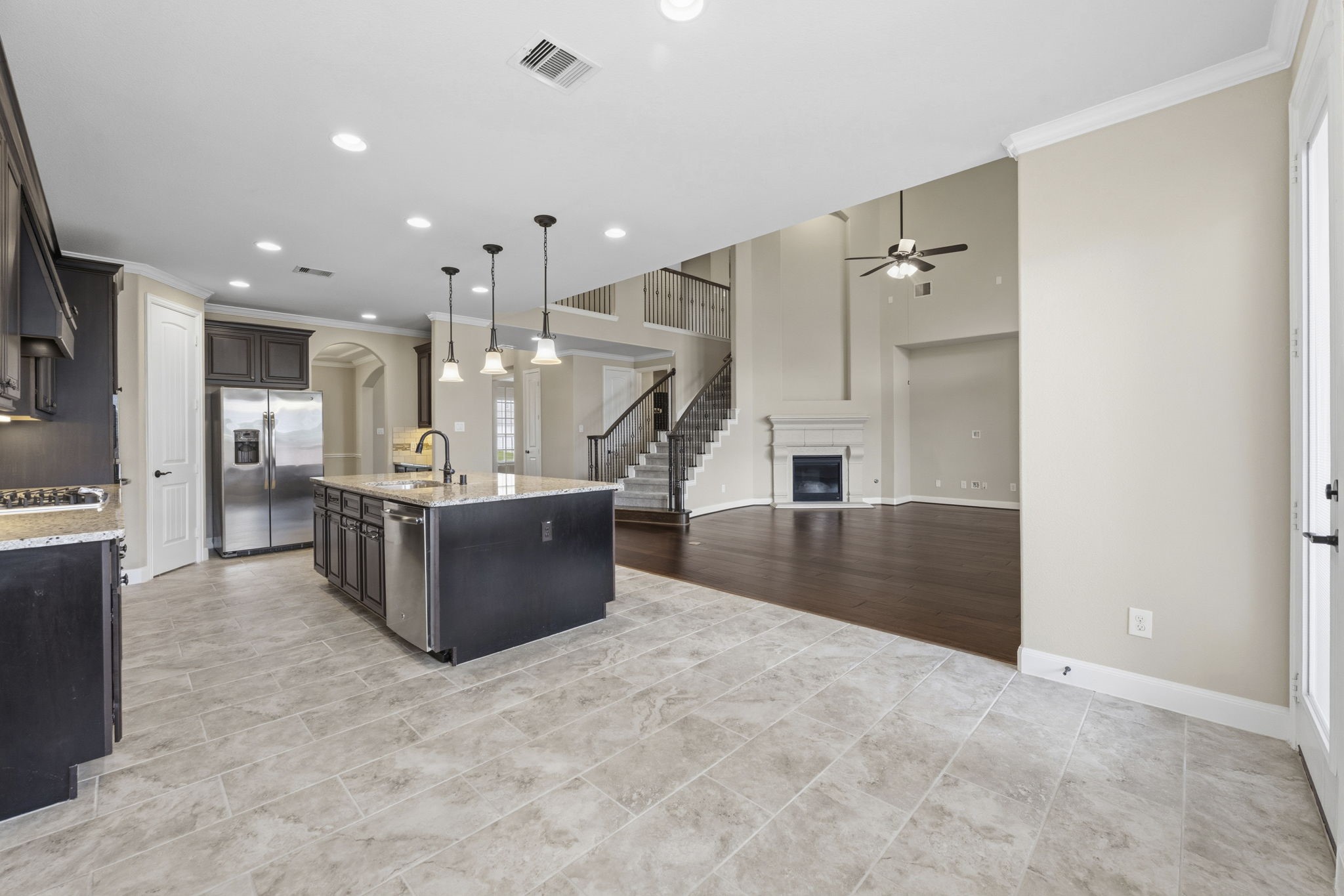 25210 Gaddis Oaks Drive Spring, TX 77389 - Photo 13 of 50 a view of kitchen with kitchen island stainless steel appliances counter top and living room