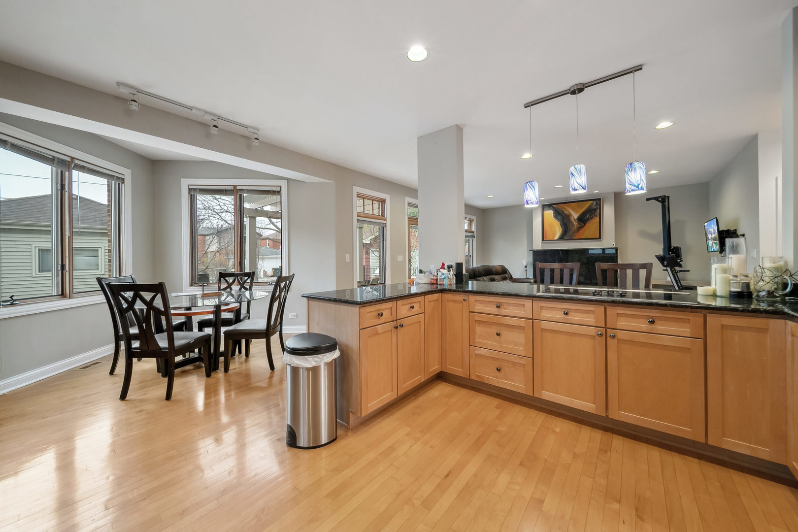 Undisclosed Address Park Ridge, IL 60068 - Photo 11 of 47 a kitchen with stainless steel appliances granite countertop dining table chairs and wooden floor