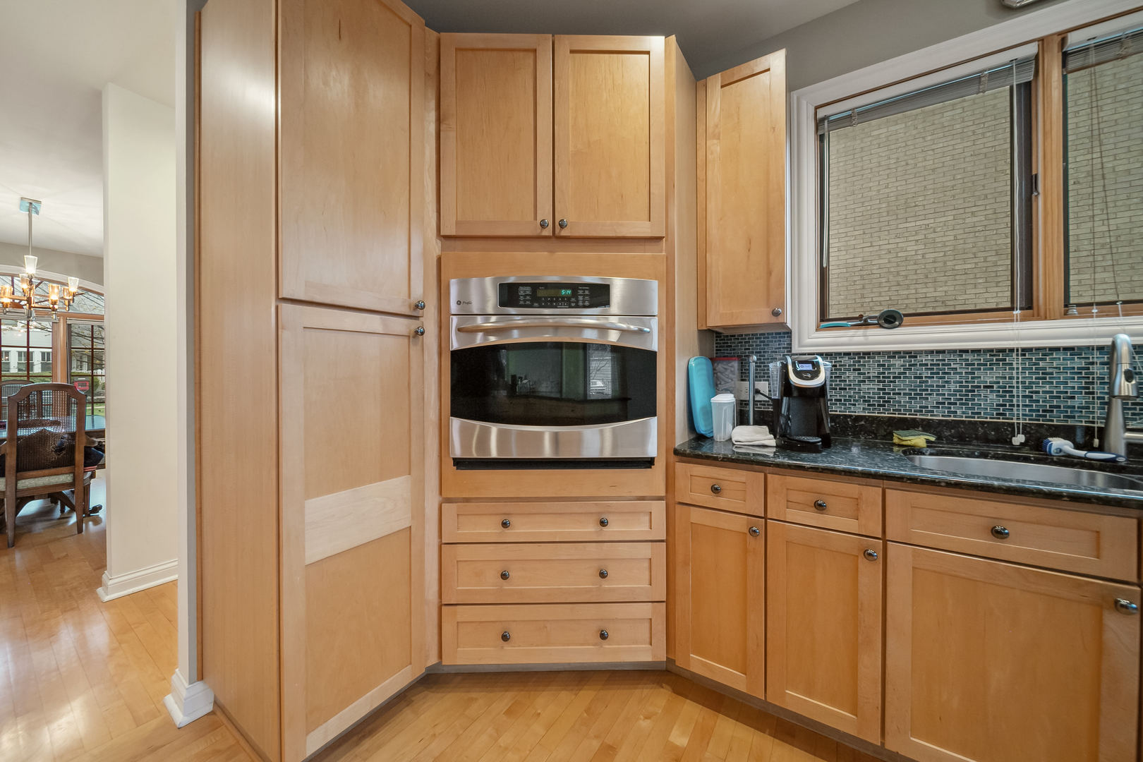 Undisclosed Address Park Ridge, IL 60068 - Photo 14 of 47 a kitchen with granite countertop white cabinets and stainless steel appliances