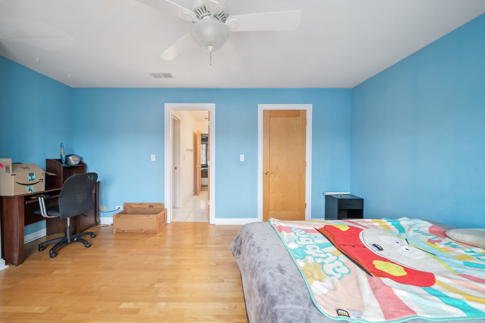 Undisclosed Address Park Ridge, IL 60068 - Photo 31 of 47 a bedroom with a bed and a chandelier