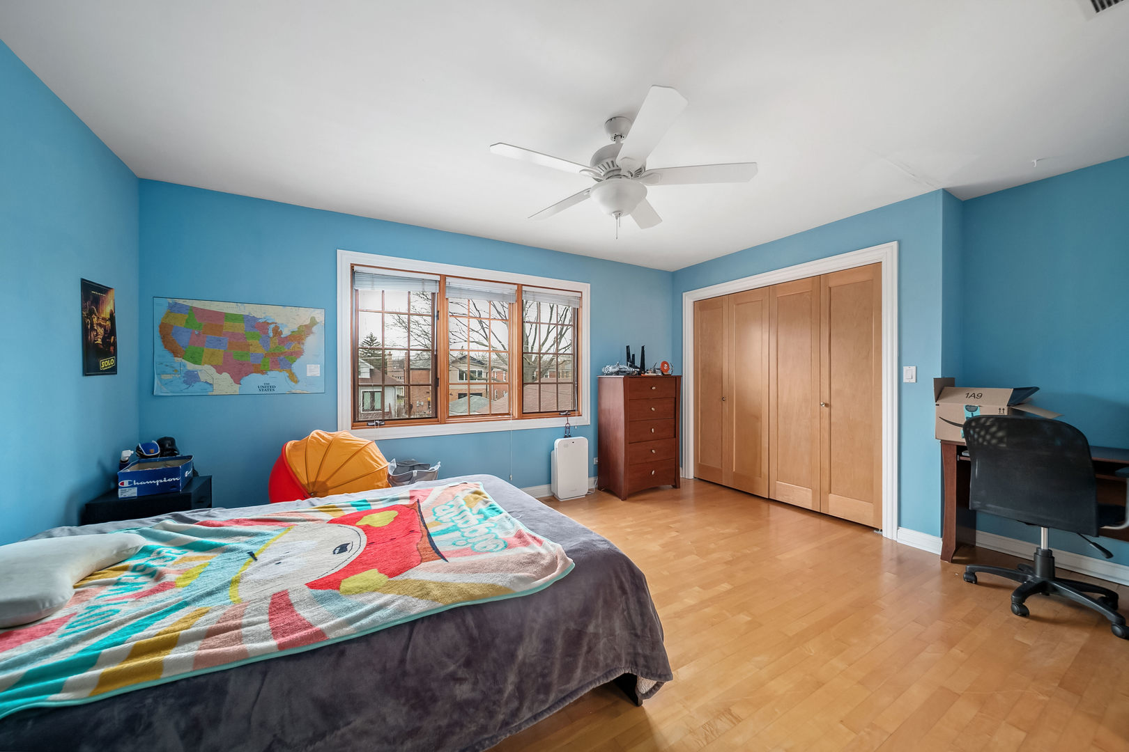 Undisclosed Address Park Ridge, IL 60068 - Photo 32 of 47 a bedroom with a bed a dresser and a window