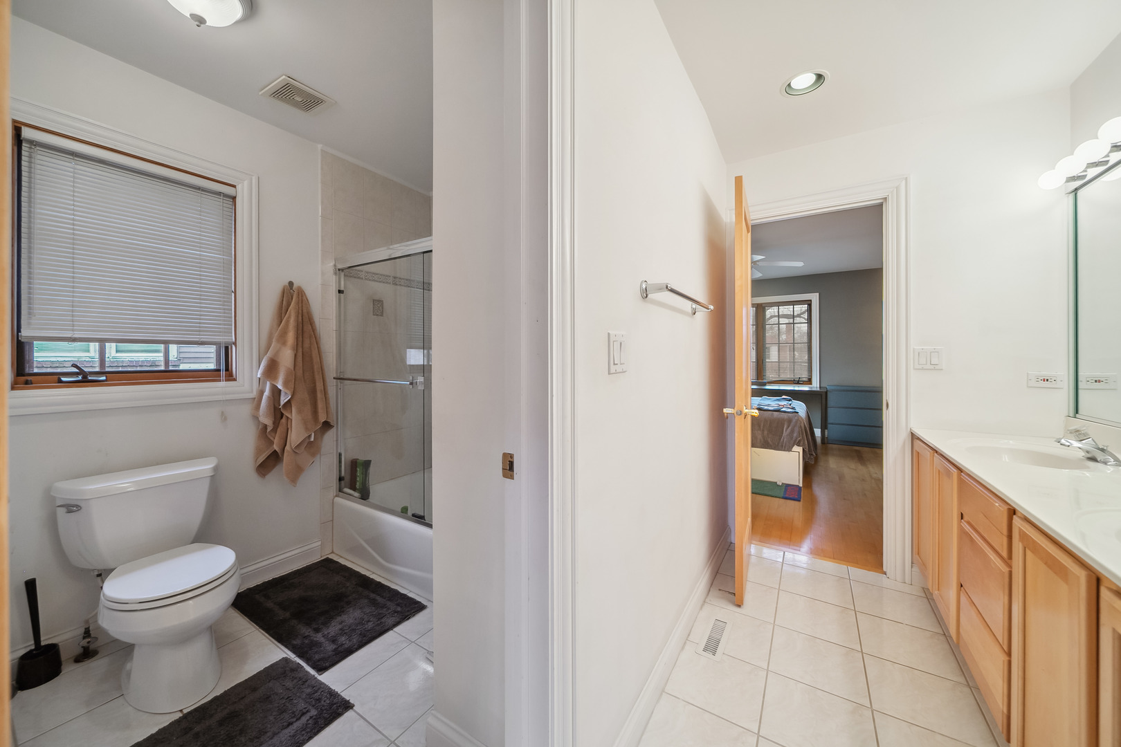 Undisclosed Address Park Ridge, IL 60068 - Photo 34 of 47 a bathroom with a granite countertop toilet a sink and a mirror