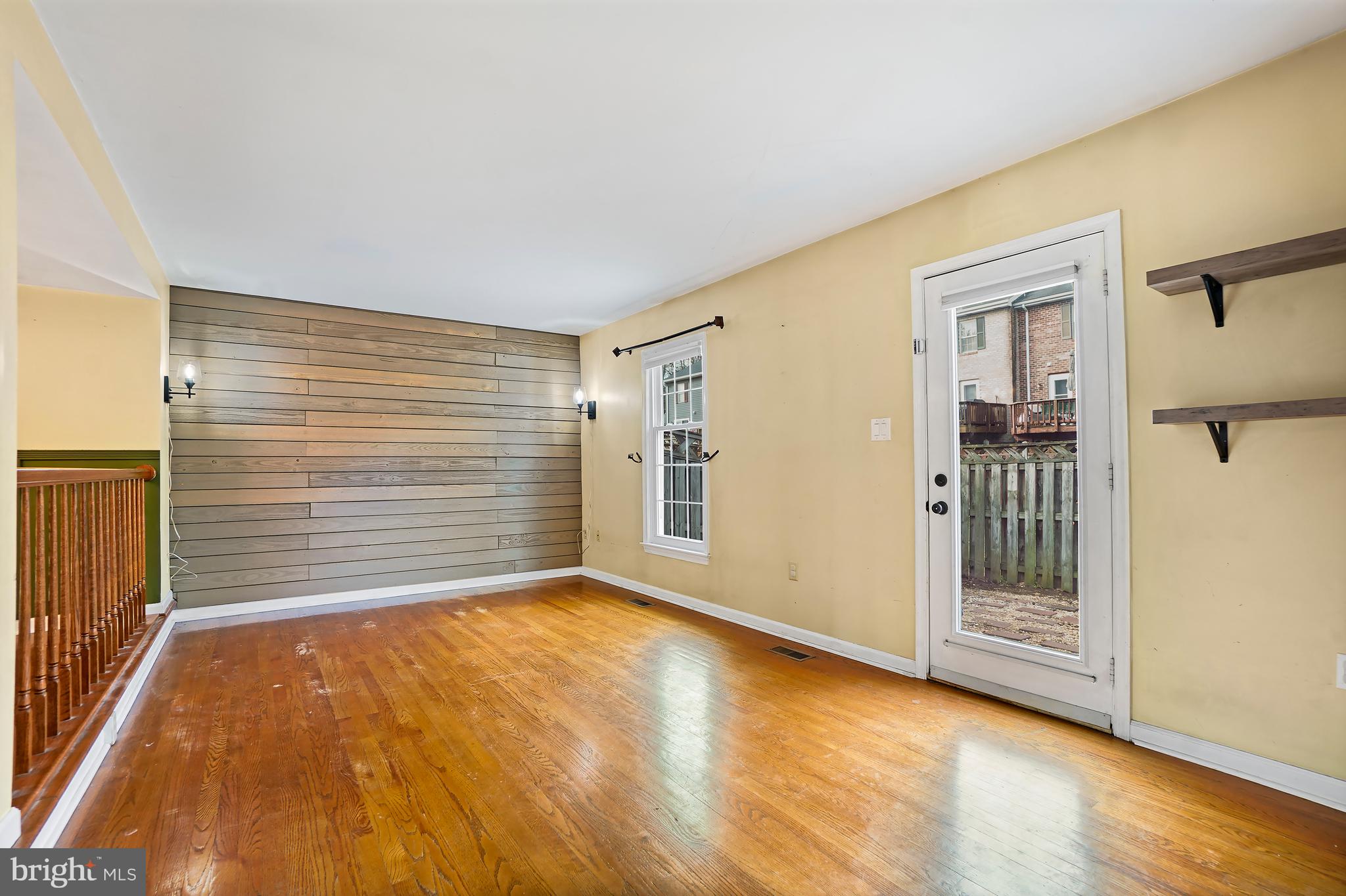 7994 Windsail Court Frederick, MD 21701 - Photo 16 of 46 a view of an empty room with wooden floor
