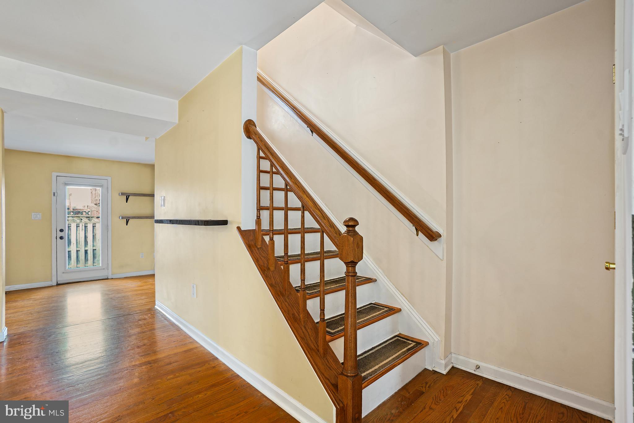 7994 Windsail Court Frederick, MD 21701 - Photo 21 of 46 a view of an entryway with wooden floor