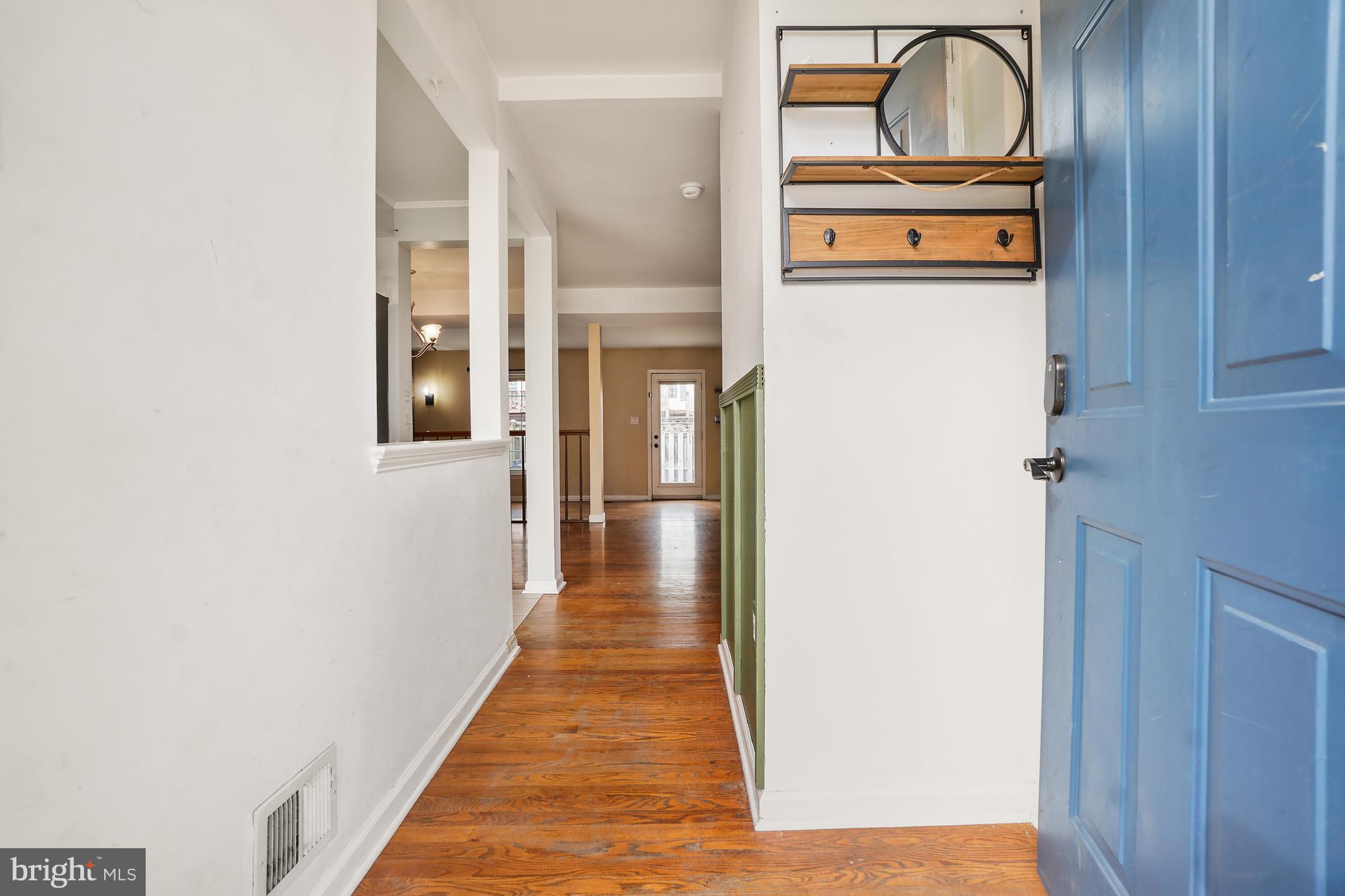 7994 Windsail Court Frederick, MD 21701 - Photo 3 of 46 a view of a hallway with wooden door