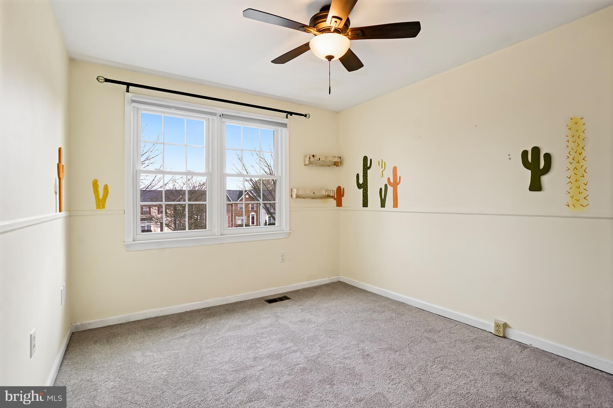7994 Windsail Court Frederick, MD 21701 - Photo 33 of 46 a view of a livingroom with a window and a ceiling fan